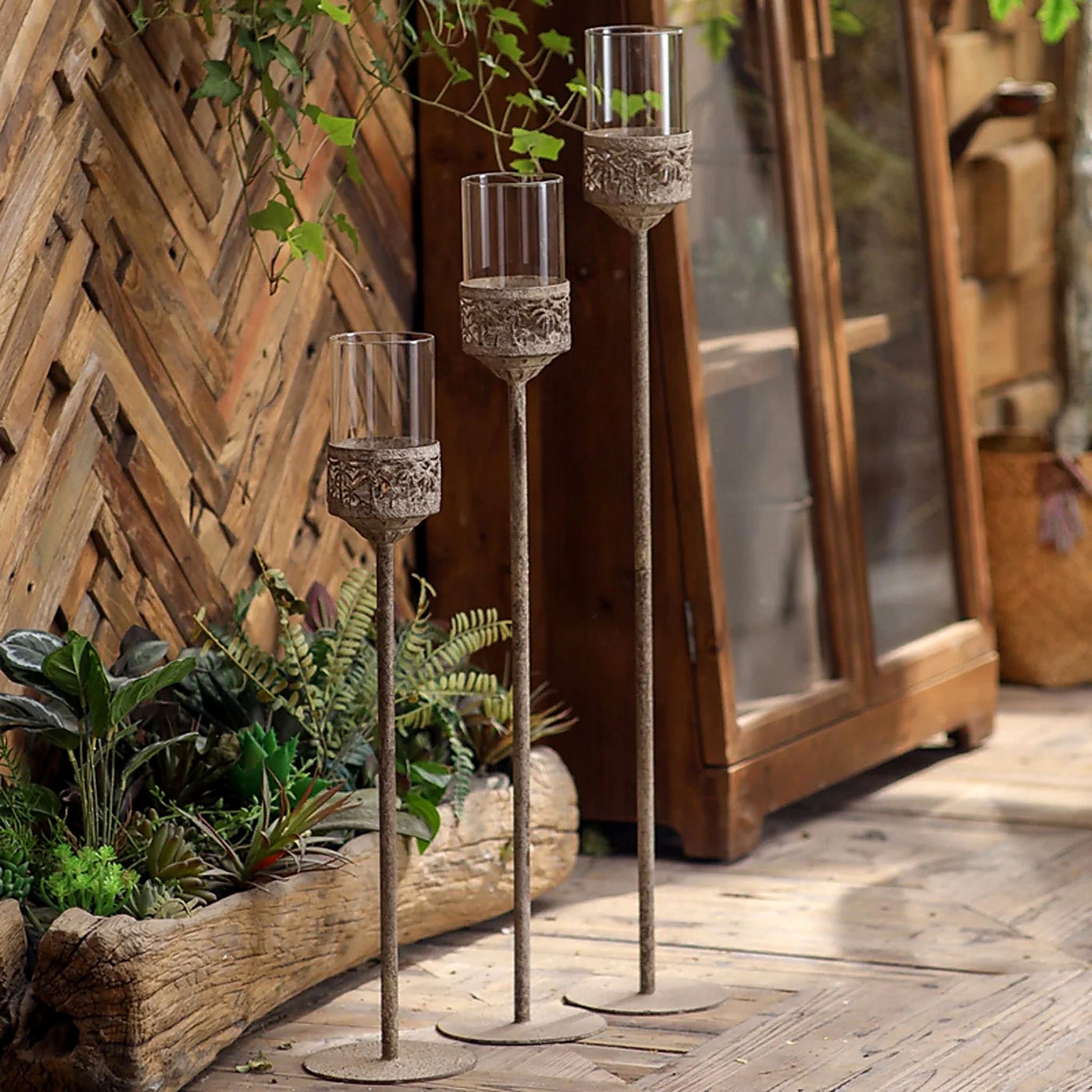 Three floor candle holders at 87.5cm, 75.5cm and 63.5cm shown together for scale