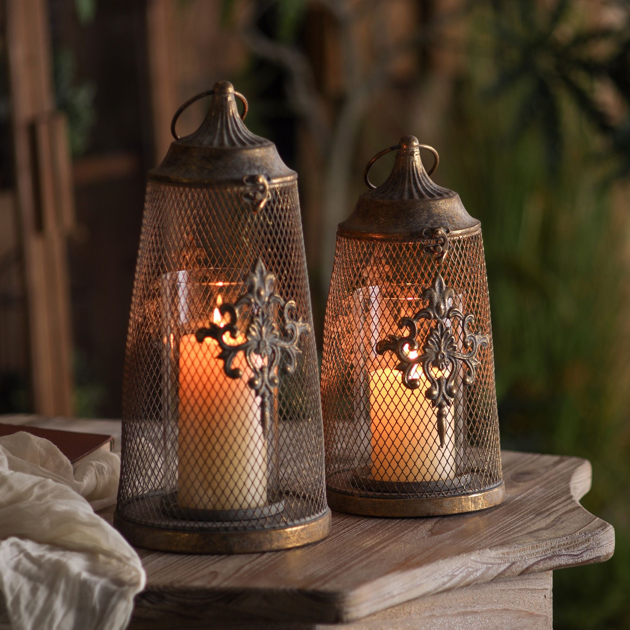 Stephanie candle lantern on the left shown lit beside the shorter Sophie lantern, sold separately