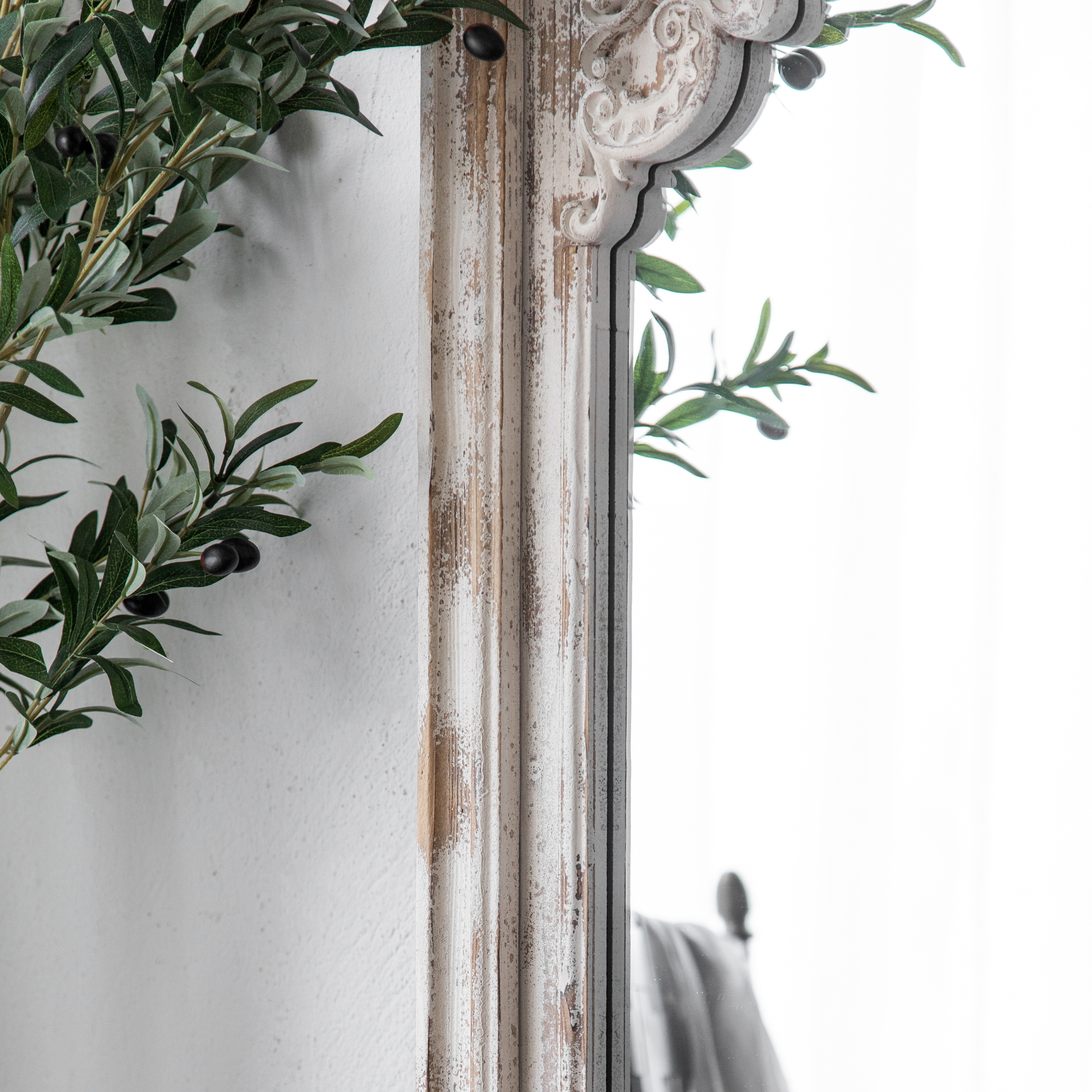 Lucien ornate floor mirror styled in a French country corner with olive branches