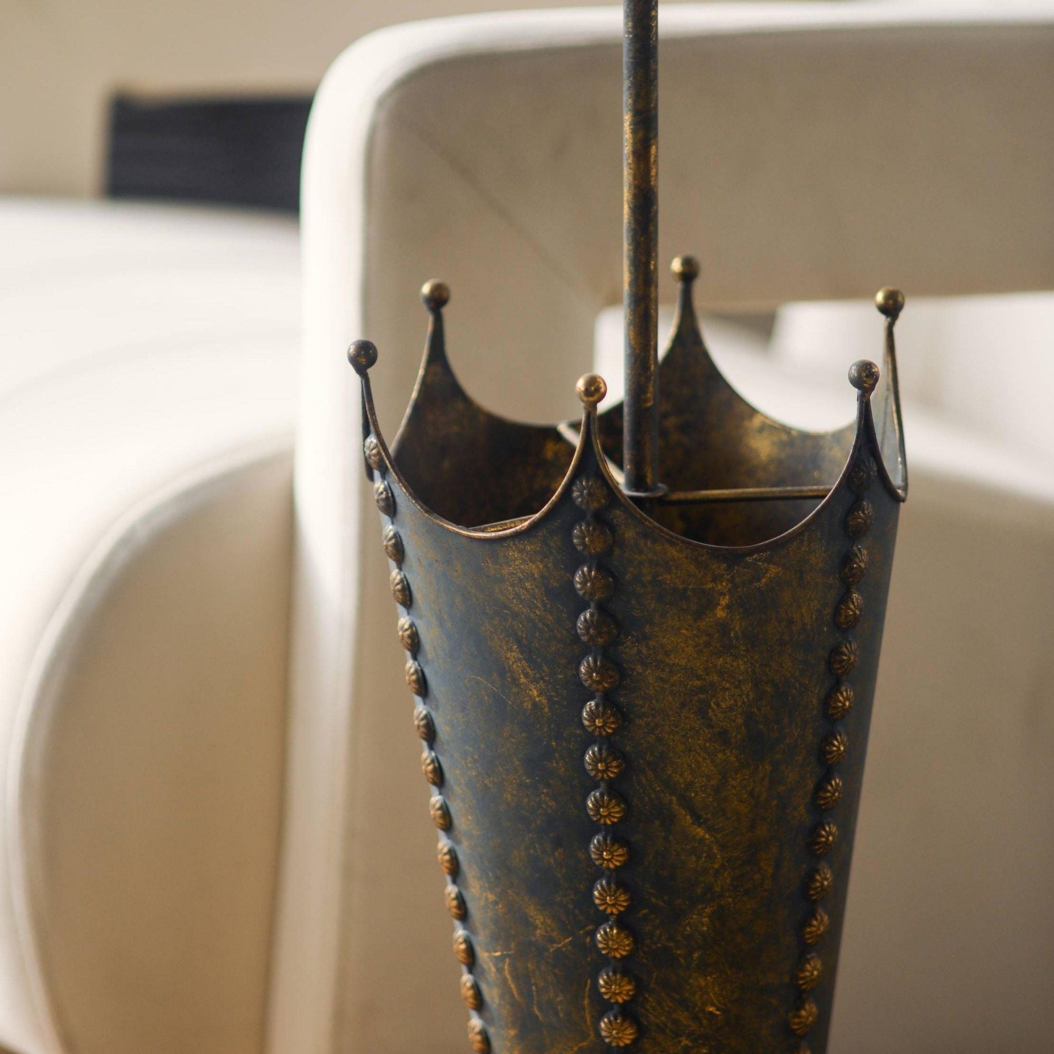 Close-up of the crown rim and studded seams on the Luna umbrella stand.