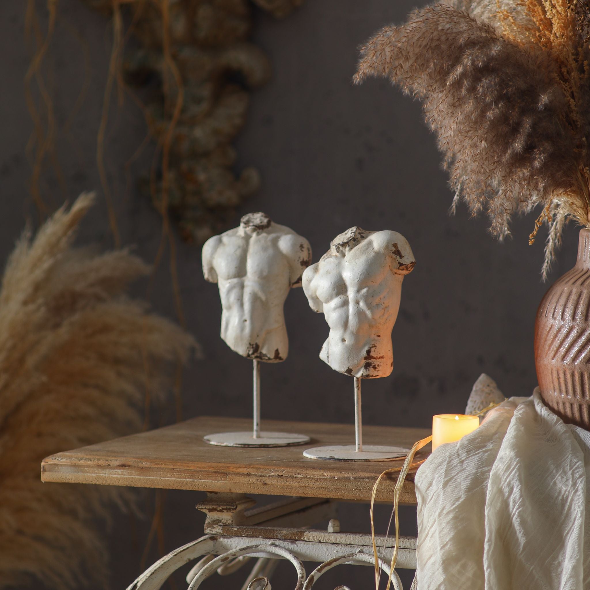 Cassius and Adonis styled together with pampas, Cassius on the left.