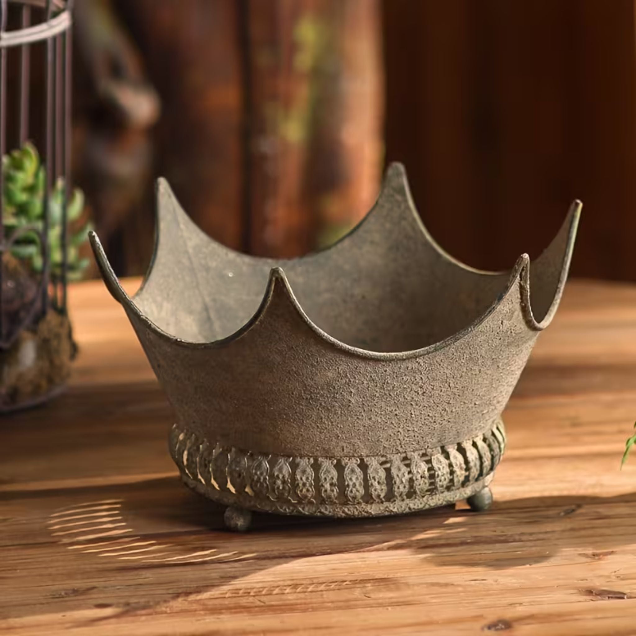 Marlene crown-shaped planter in distressed grey metal, empty, showing the pointed tips and ball feet
