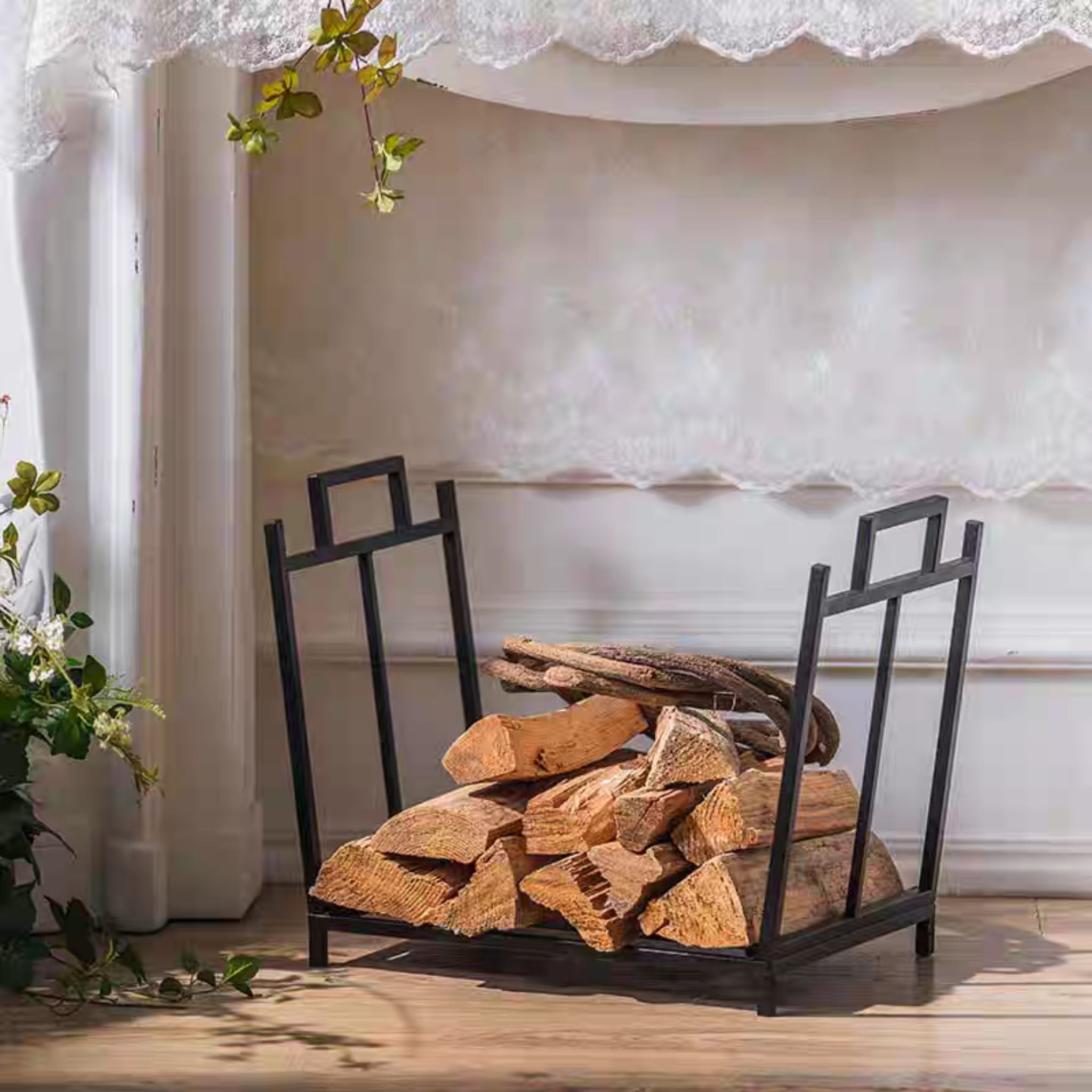 The Gaultier firewood holder filled with split logs and kindling, seen from the front by a window.