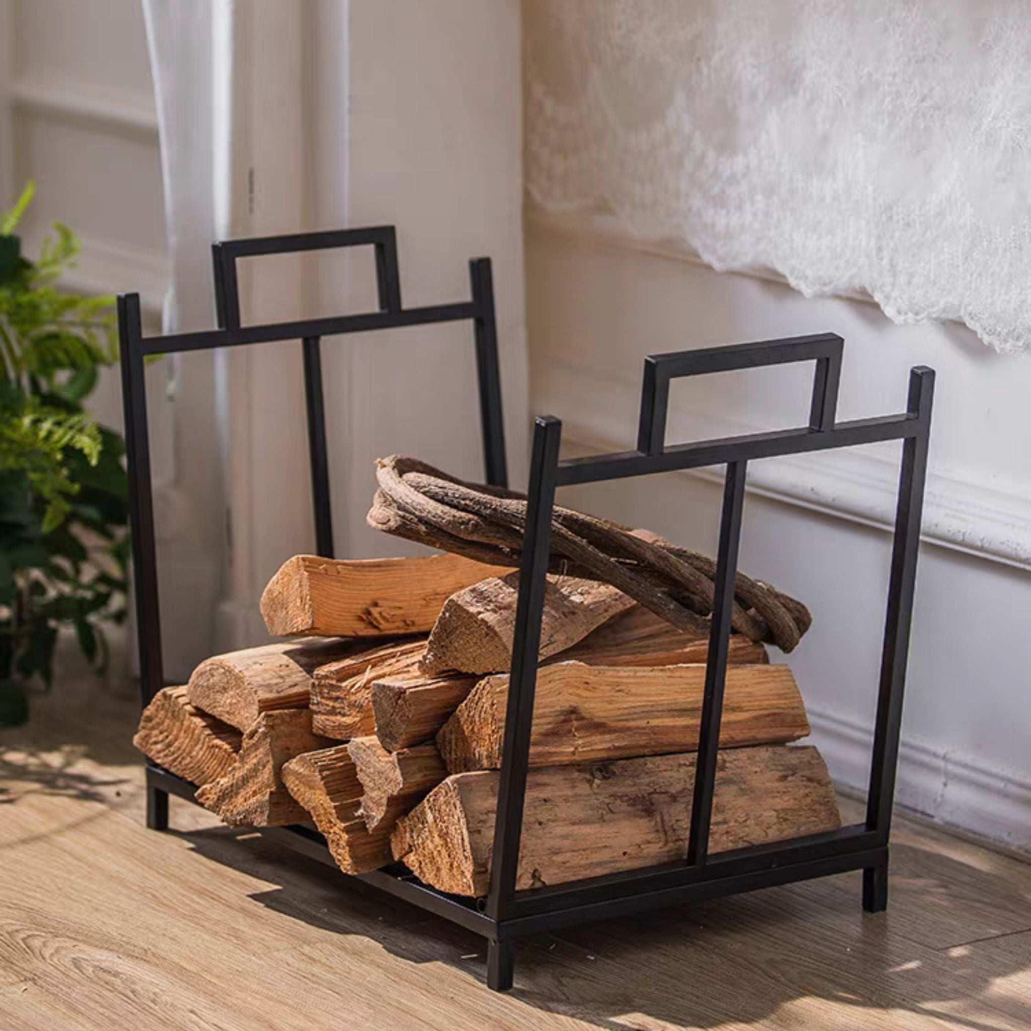 Angled view of the Gaultier log holder showing the square carry handles cut into each side panel.