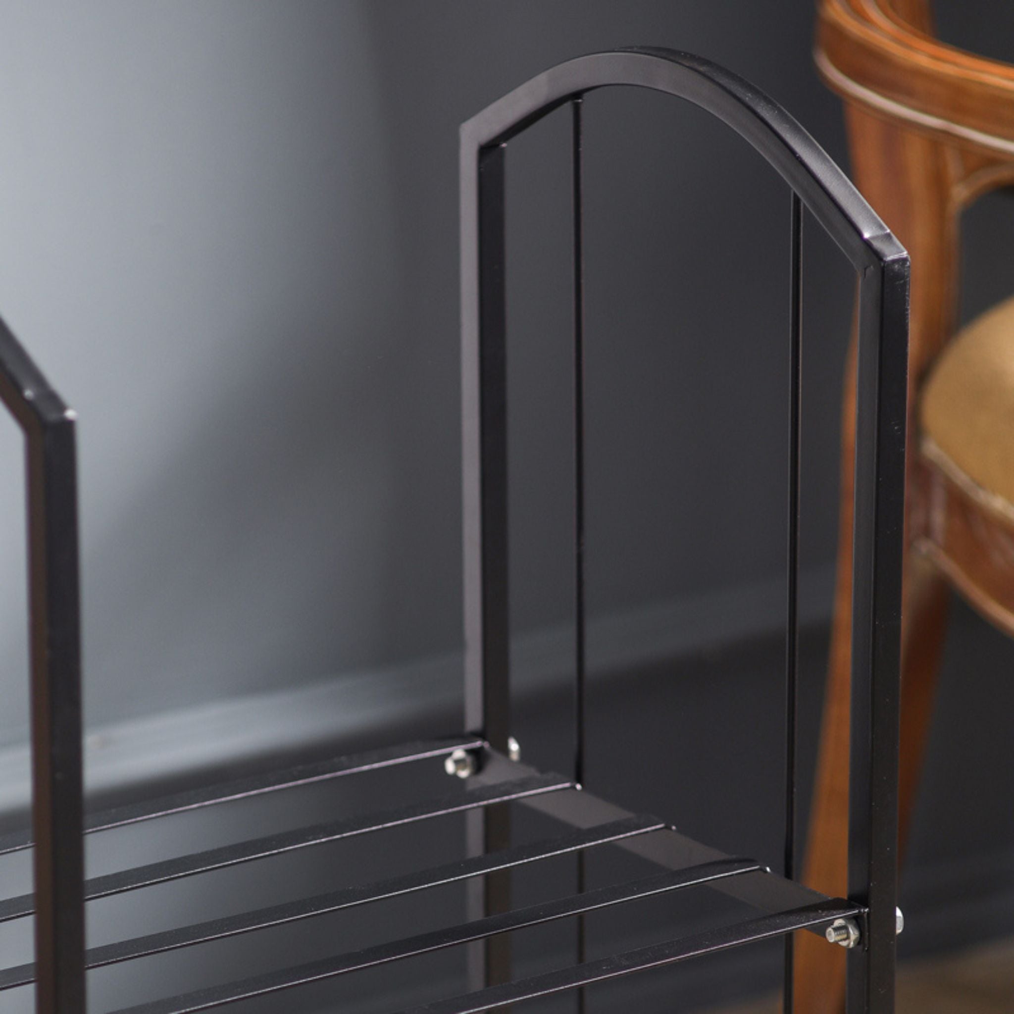 Close-up of the arched top and slim vertical bars on the Didier log rack.