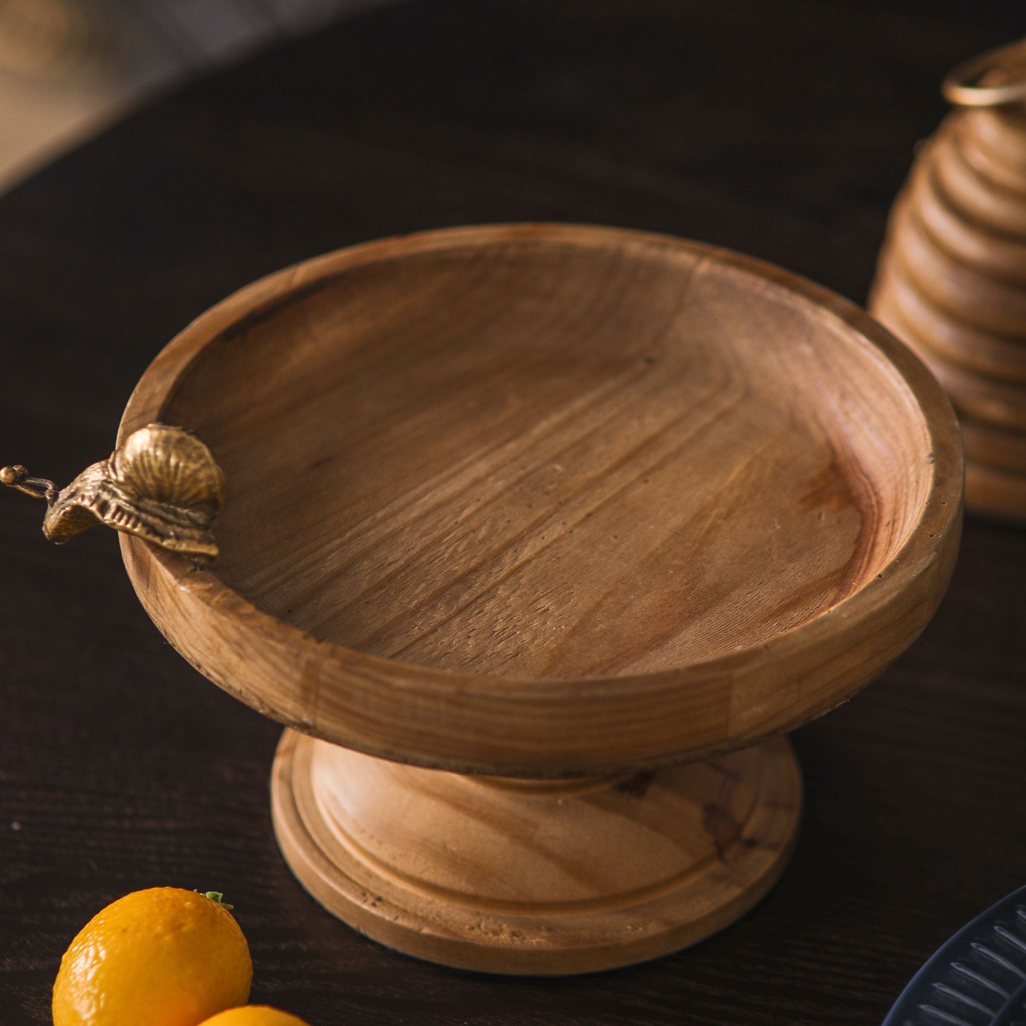 Mia French Provincial footed wooden tray in natural timber with a cast brass snail on the rim.