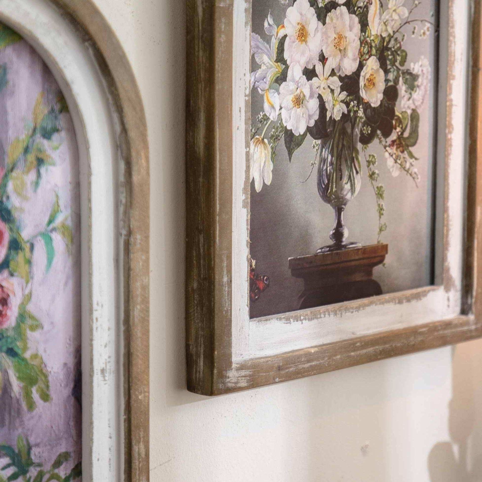 Angled view of the Nadine arched floral wall art showing the frame depth.