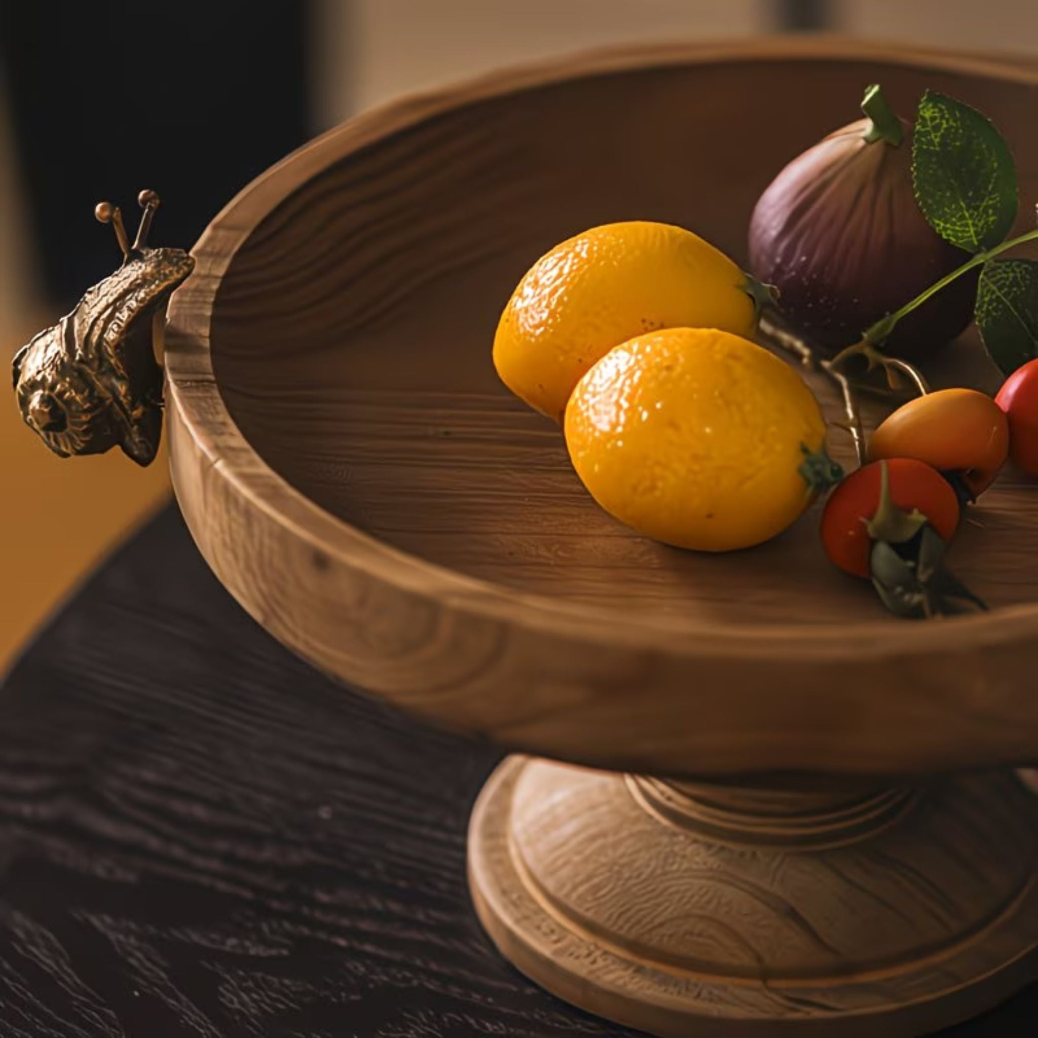 Close-up of the cast brass snail resting on the low rim of the Ninette wooden tray.