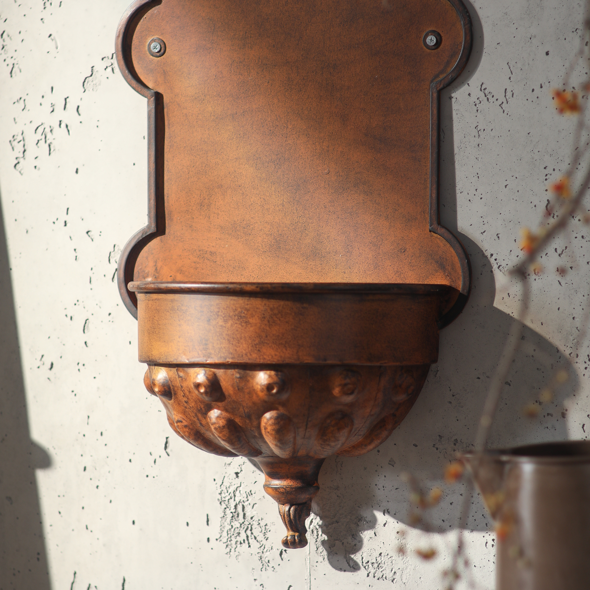 Close-up of the bowl section showing the hand-finished repoussé bulb detail and decorative foot