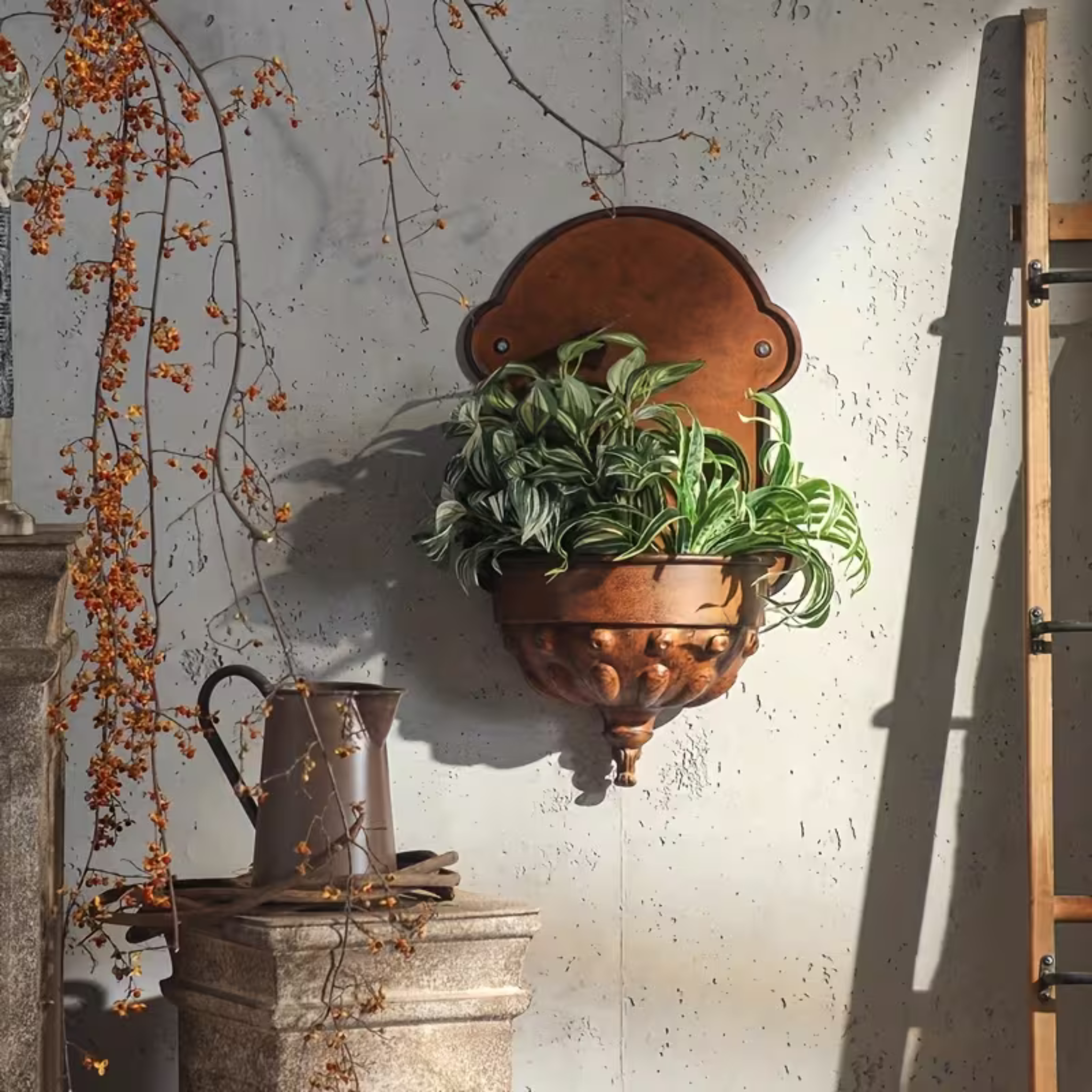 Olivier wall planter shown from a slightly elevated angle, plants spilling over the bulbous rim