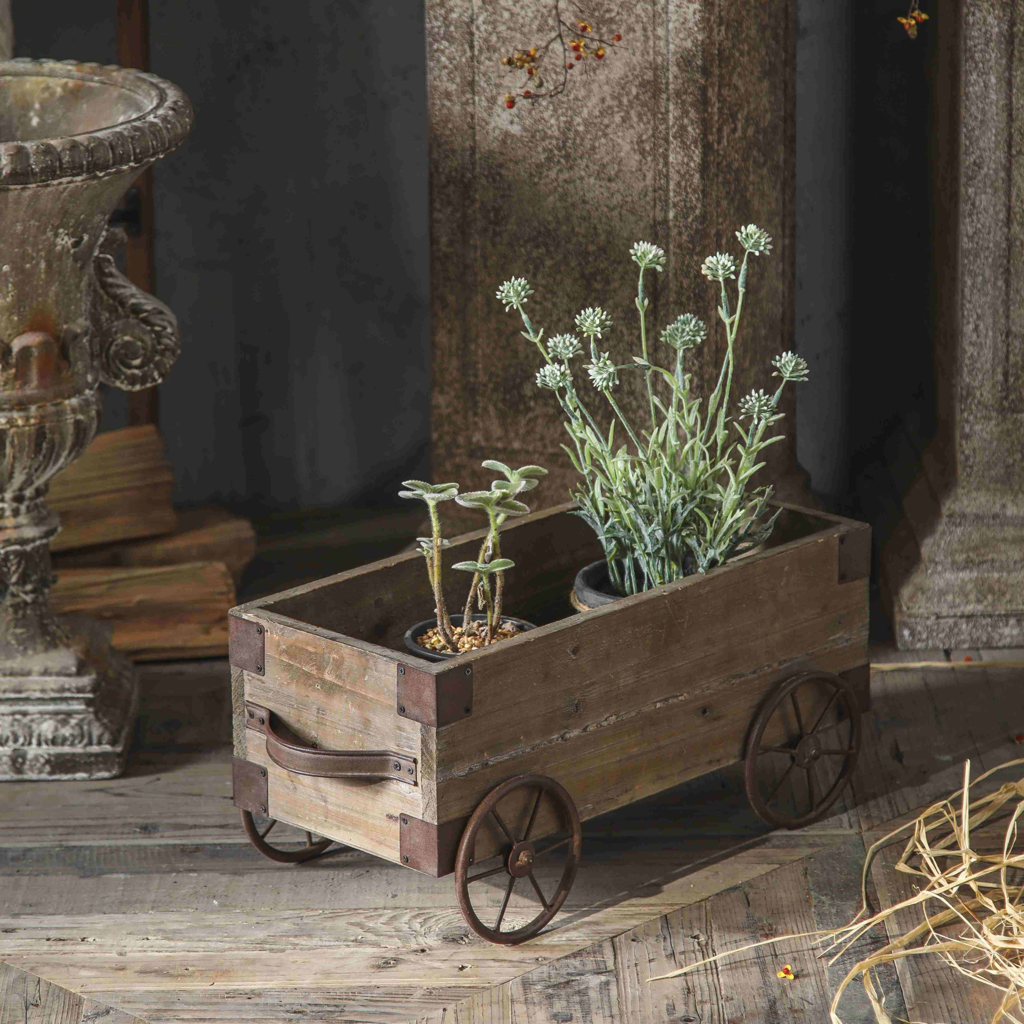 Three-quarter view of Pascal cart planter showing front iron handle and wood grain