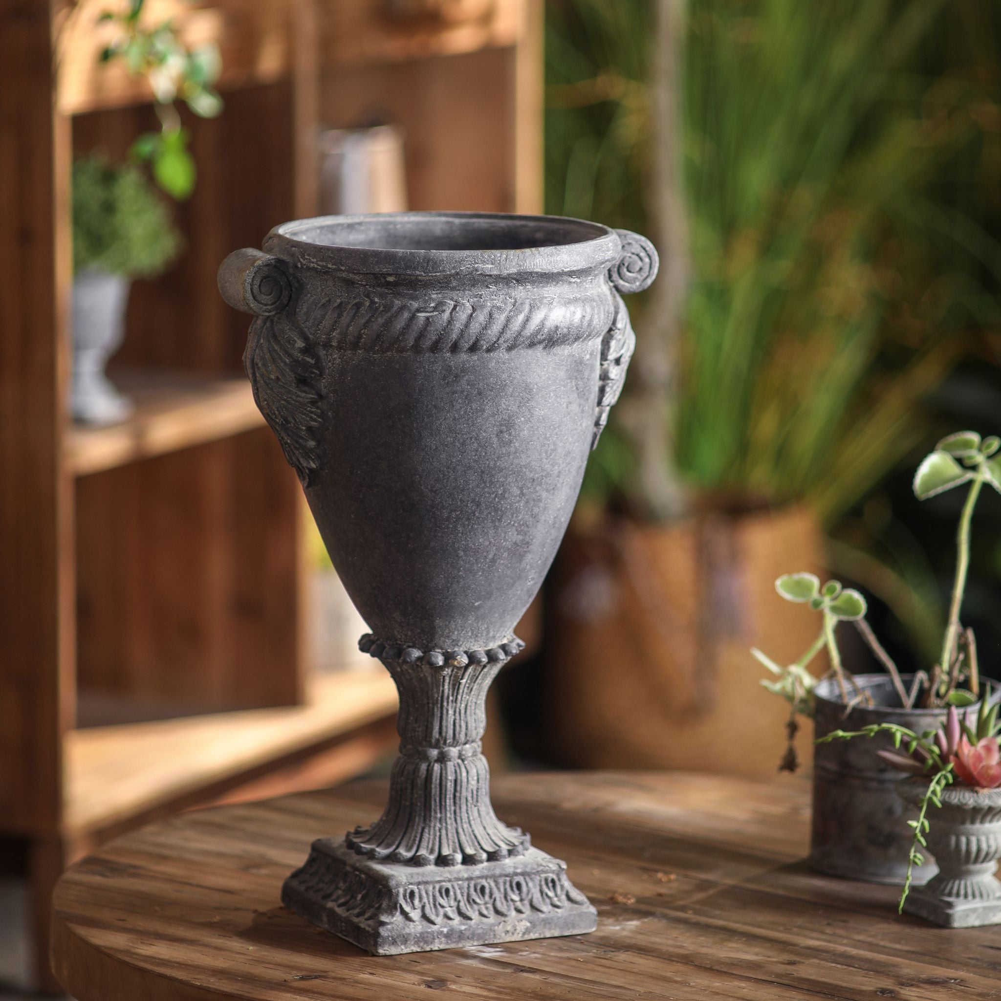 Patrick goblet urn planter shown empty, scroll handles, cabled collar, amphora bowl and reeded stem in lead-grey.
