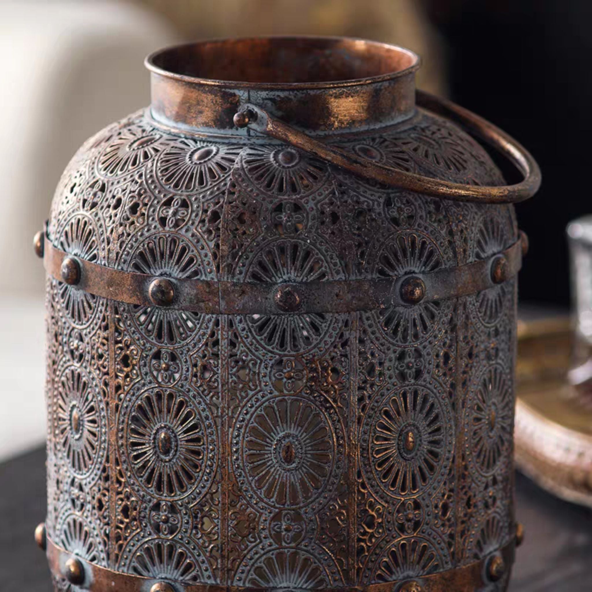 Close-up of the carry handle, rim and pierced upper body of the Aicha lantern