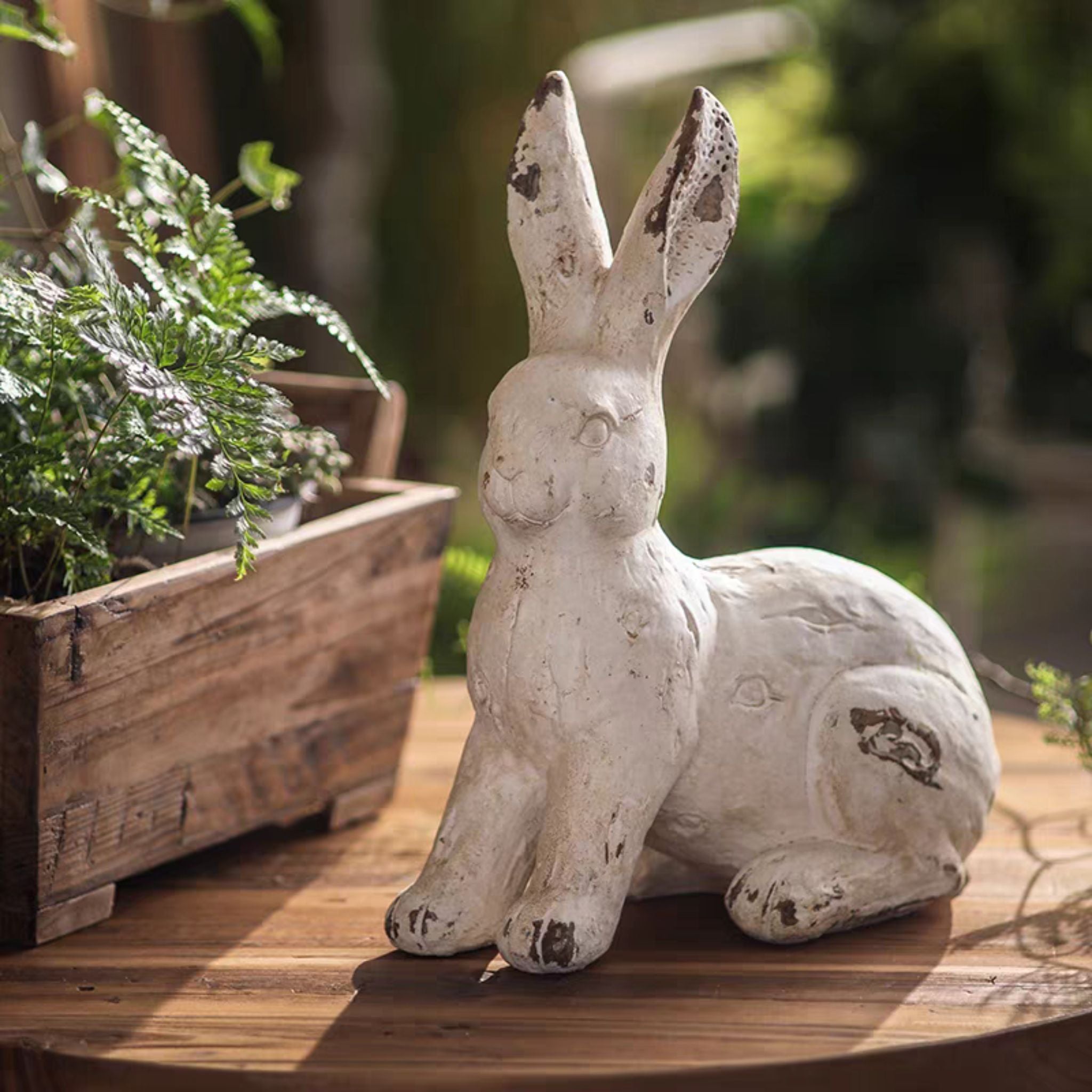 Pomme sitting-tall rabbit statue, 30cm, side profile showing the upright pose and aged patina