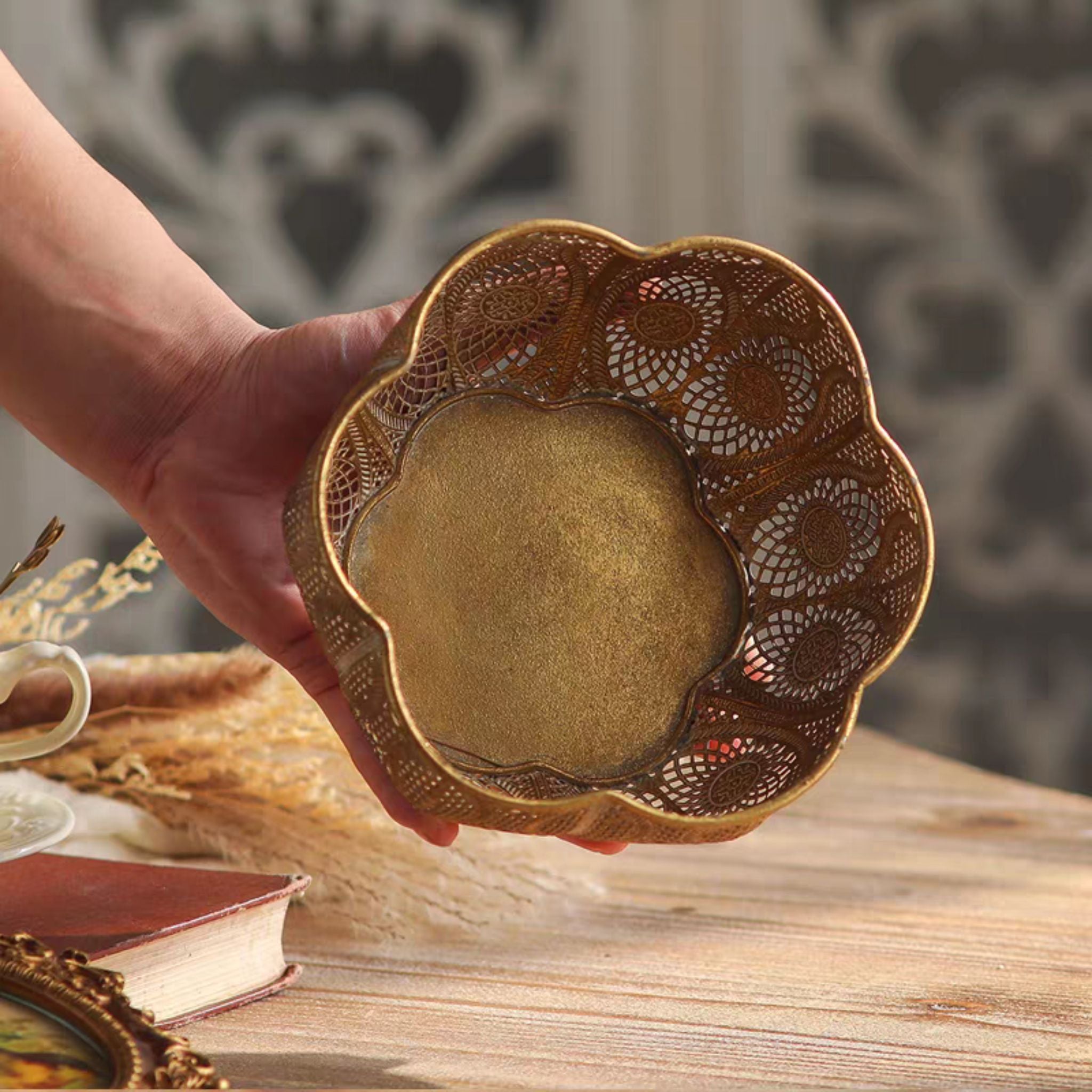 Top view of the Rosalee antique gold bowl showing the scalloped petal rim and pierced base
