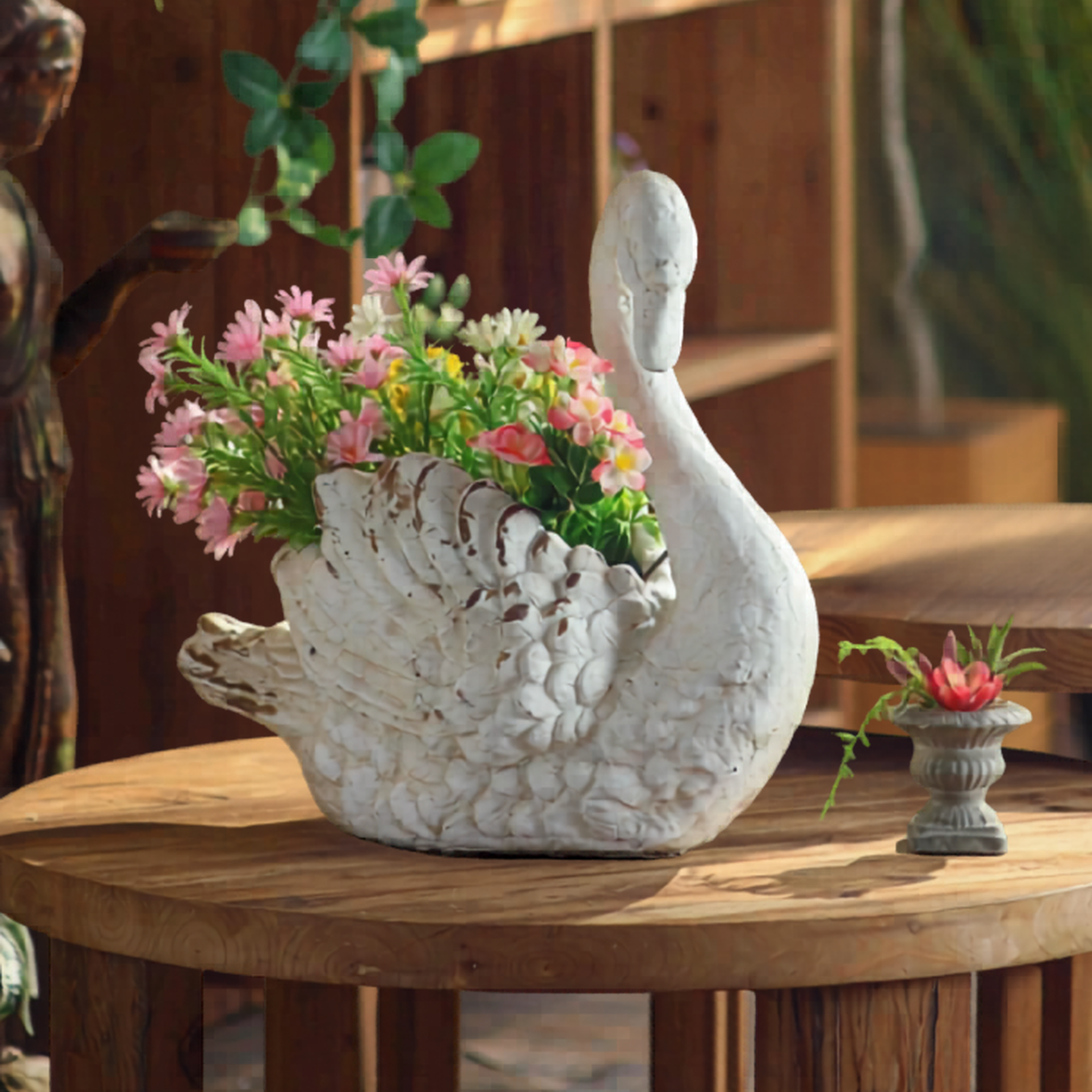 Whitewashed swan planter styled with pink daisies and roses on rustic timber table, French country garden decor