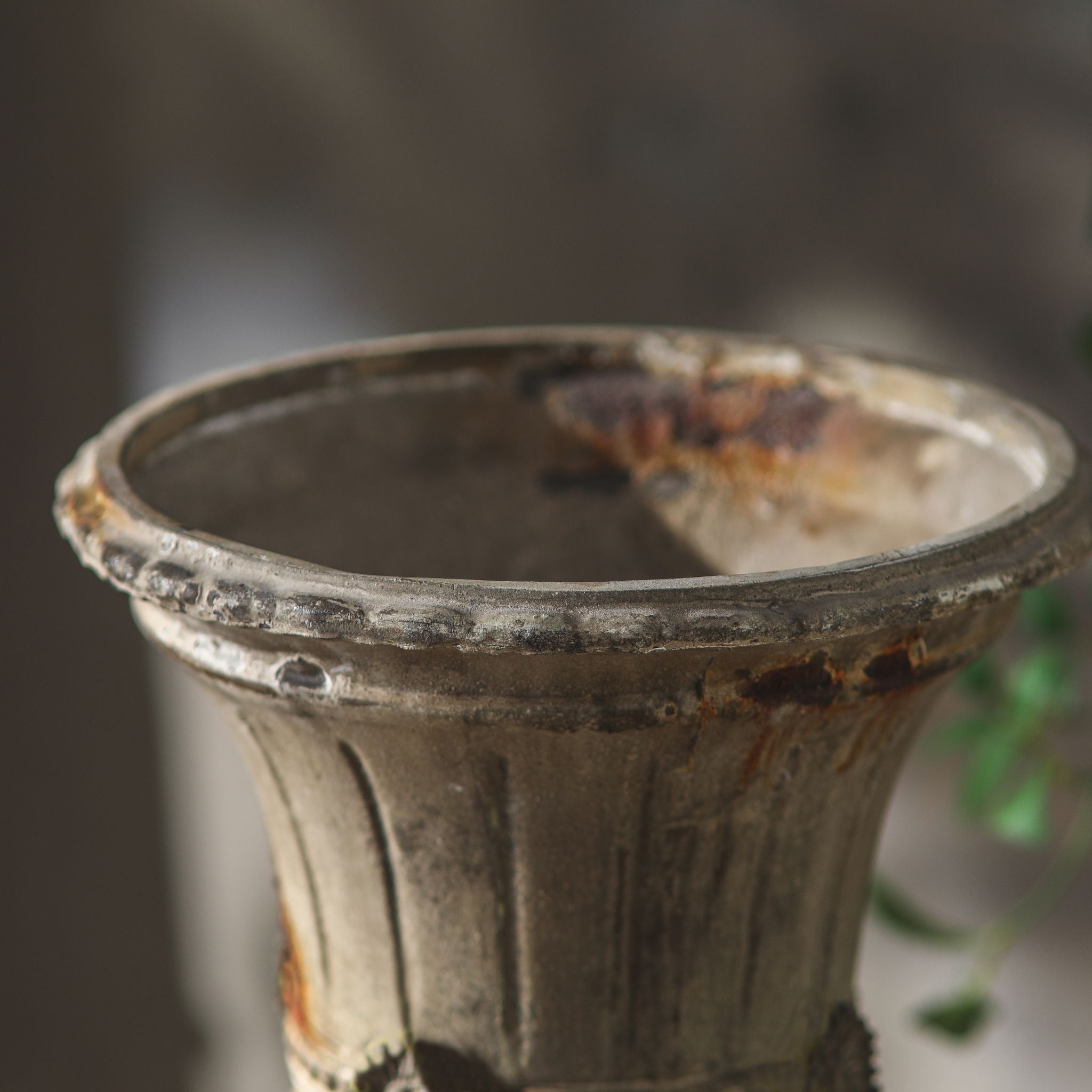 Close-up of the rosette medallion and beaded band on the Julie urn