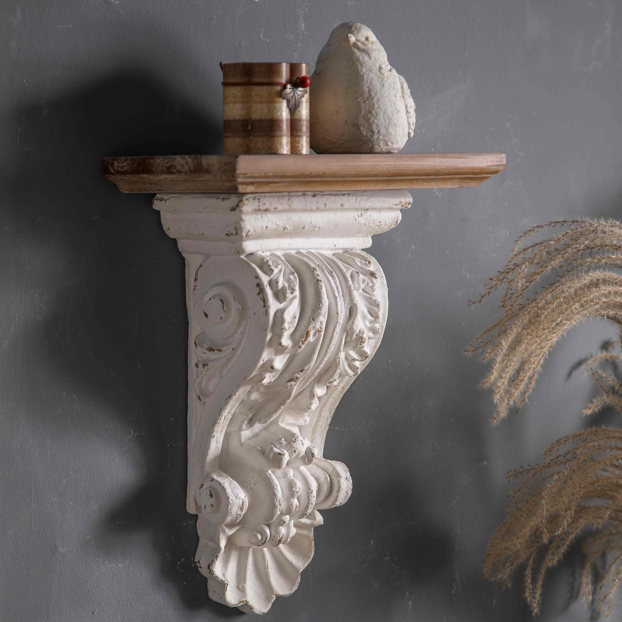 Viviane distressed white corbel wall shelf with a fir timber top, mounted on a grey wall.