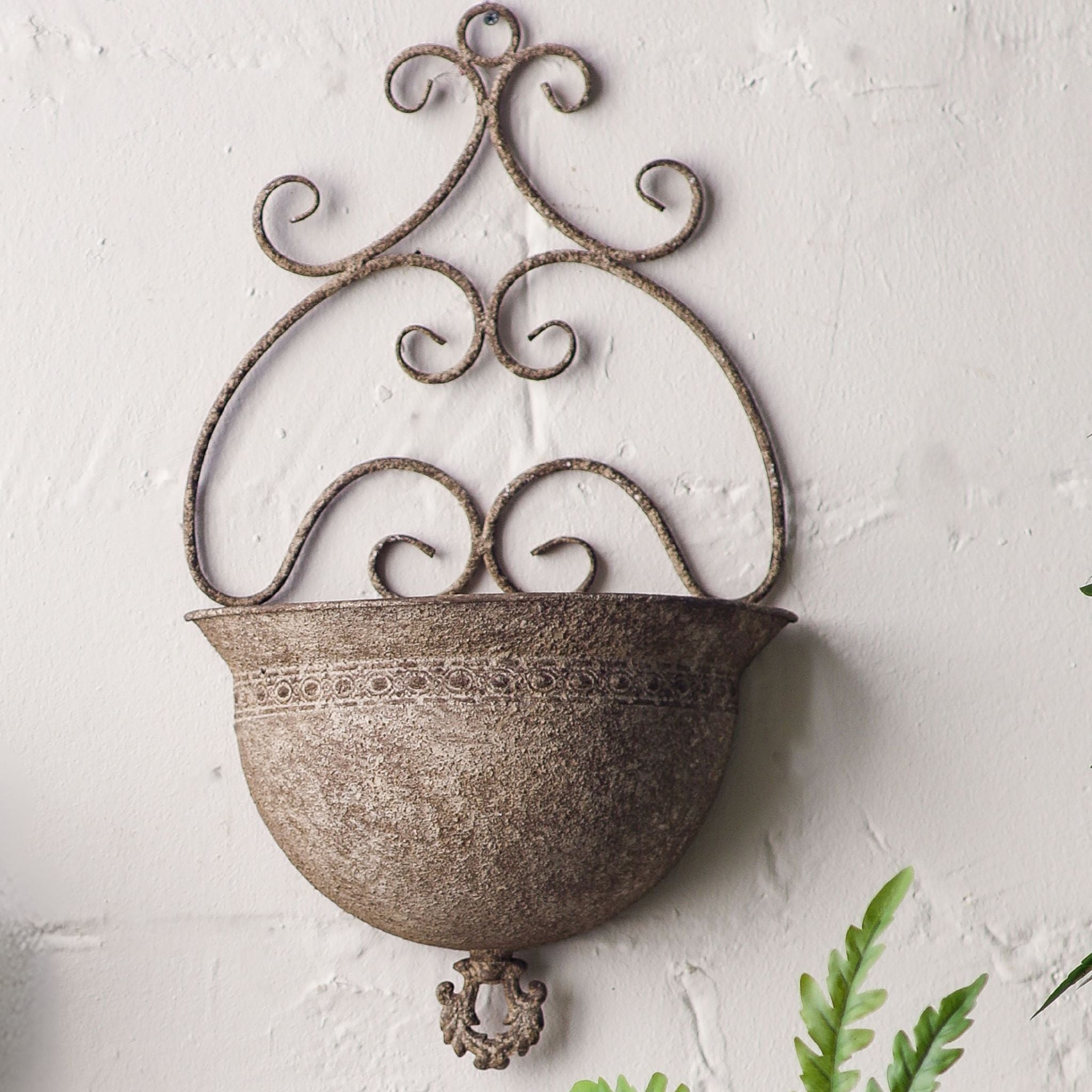 Sabine aged metal wall planter, scrolled French Provincial back over a half-bowl with a decorative rim band