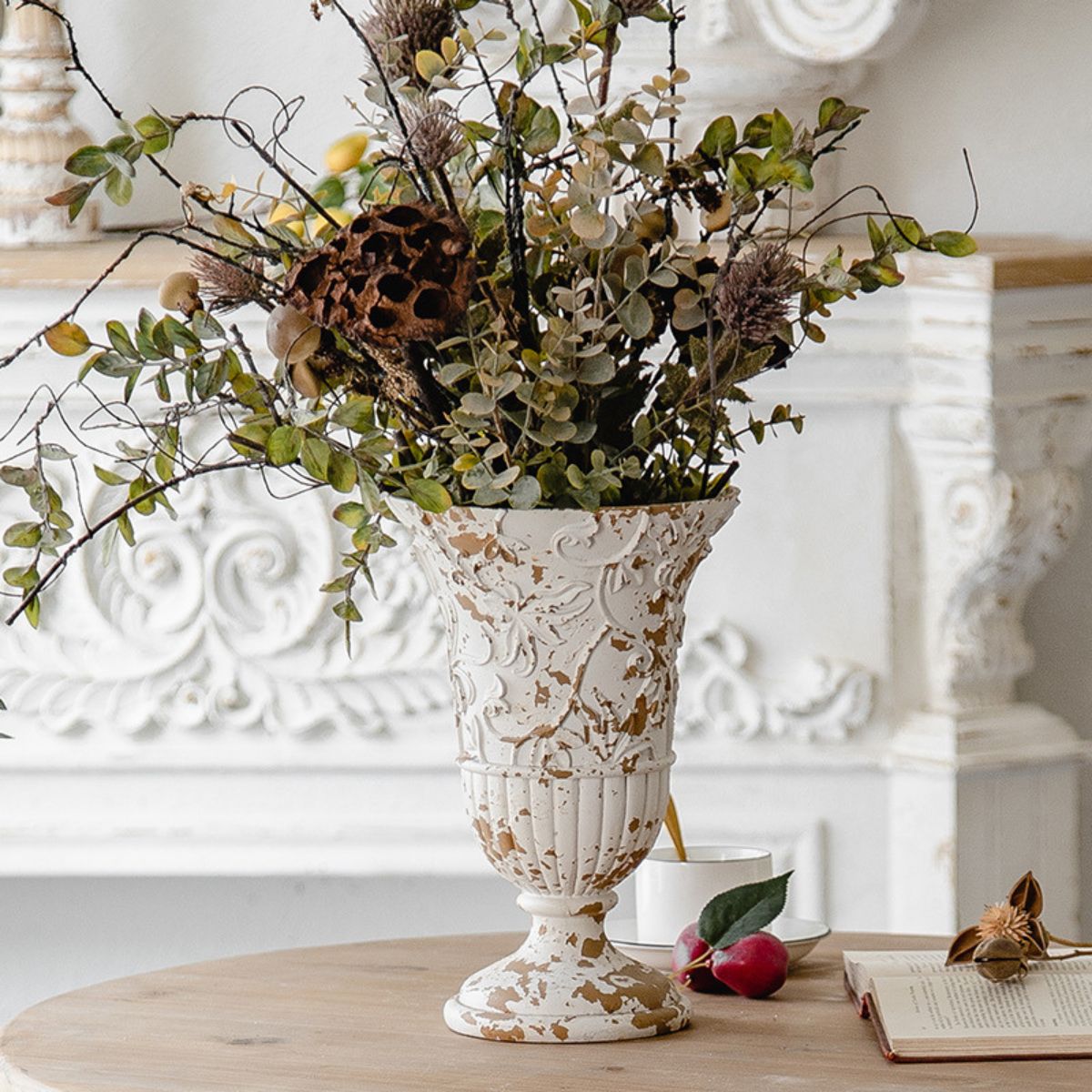 Andrea flower vase in distressed white with ornate carved detail styled with dried floral arrangement and vintage styling