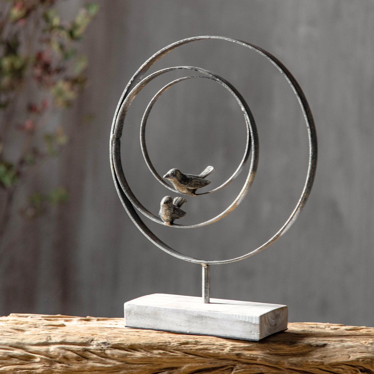 Tristan French Provincial bird sculpture — two metal birds on concentric rings with whitewashed timber base