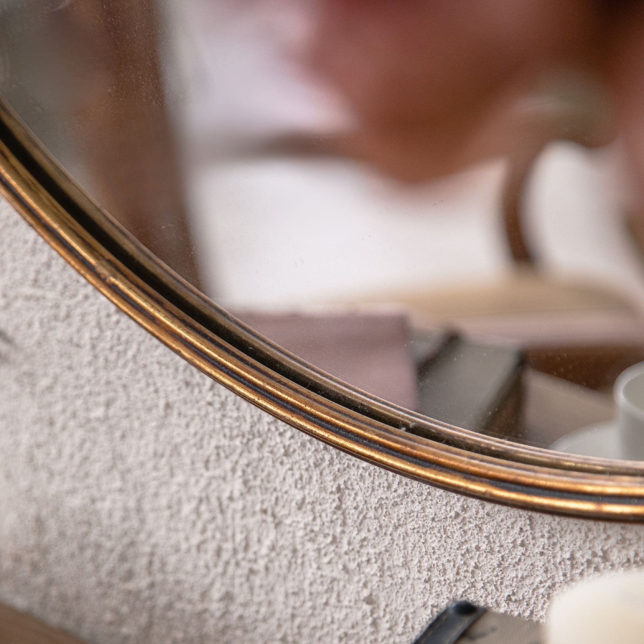 Detail of the slender reeded antique gold frame edge on the Serena mirror