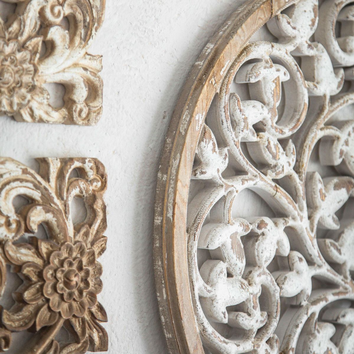 Distressed whitewashed timber edge of the Amber carved wall art
