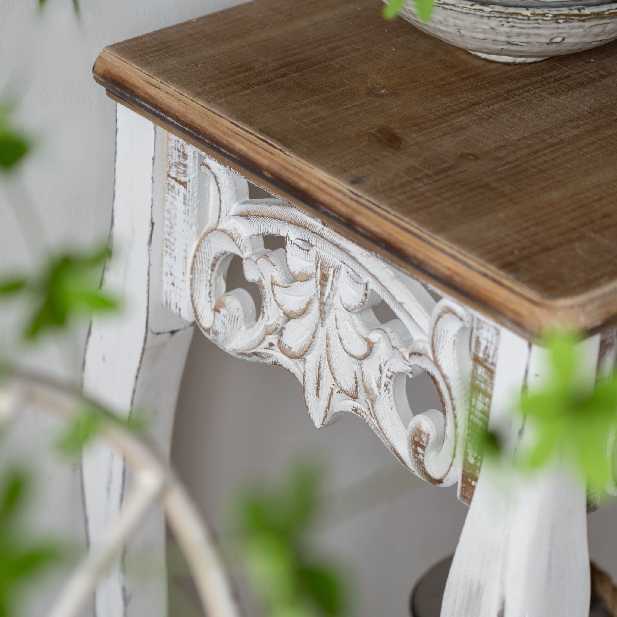 Fedora console table styled against a wall with decor