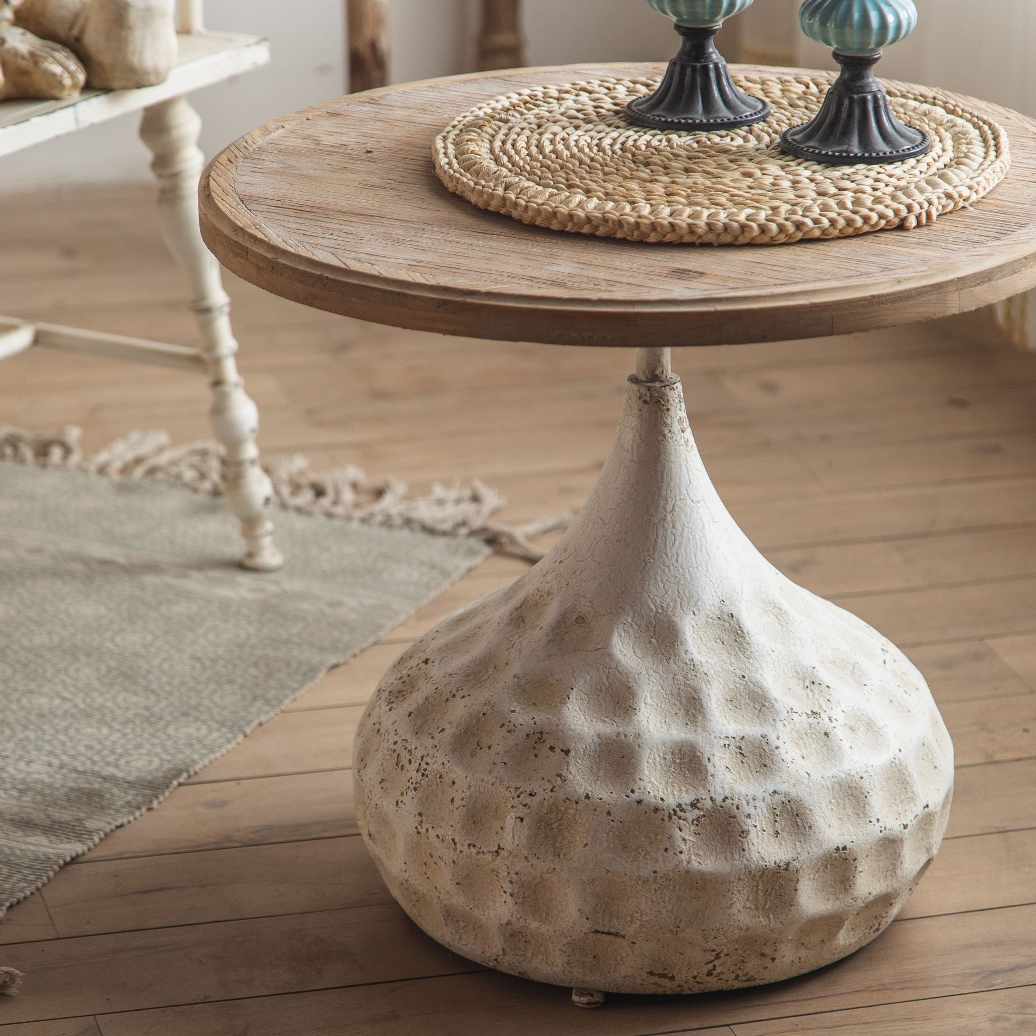 Tullia side table hammered bronze teardrop pedestal close up