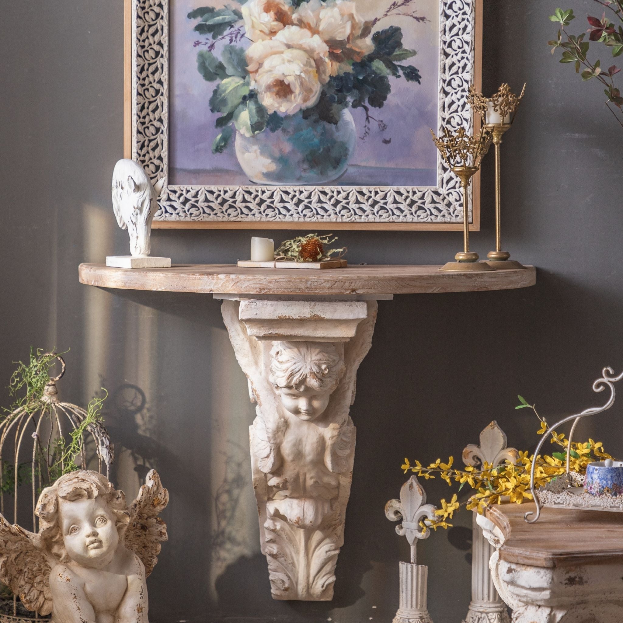 Ornella wall console with cherub corbel and washed fir demilune top styled beneath artwork