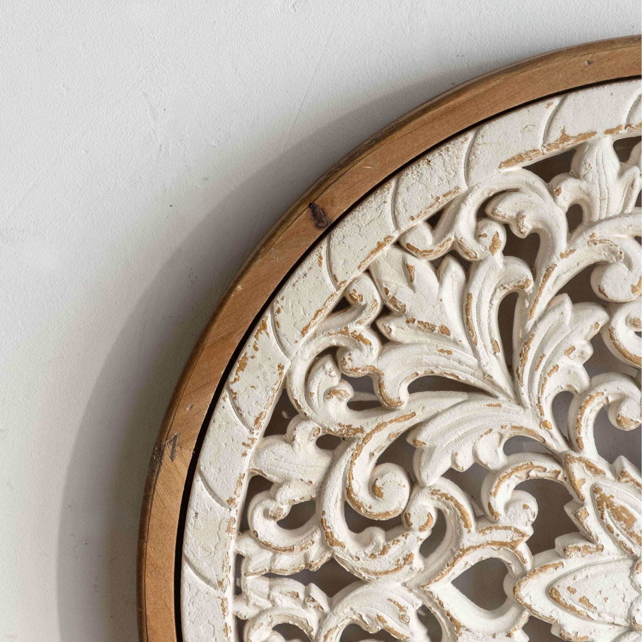Velia round wall art radiating petal carving detail