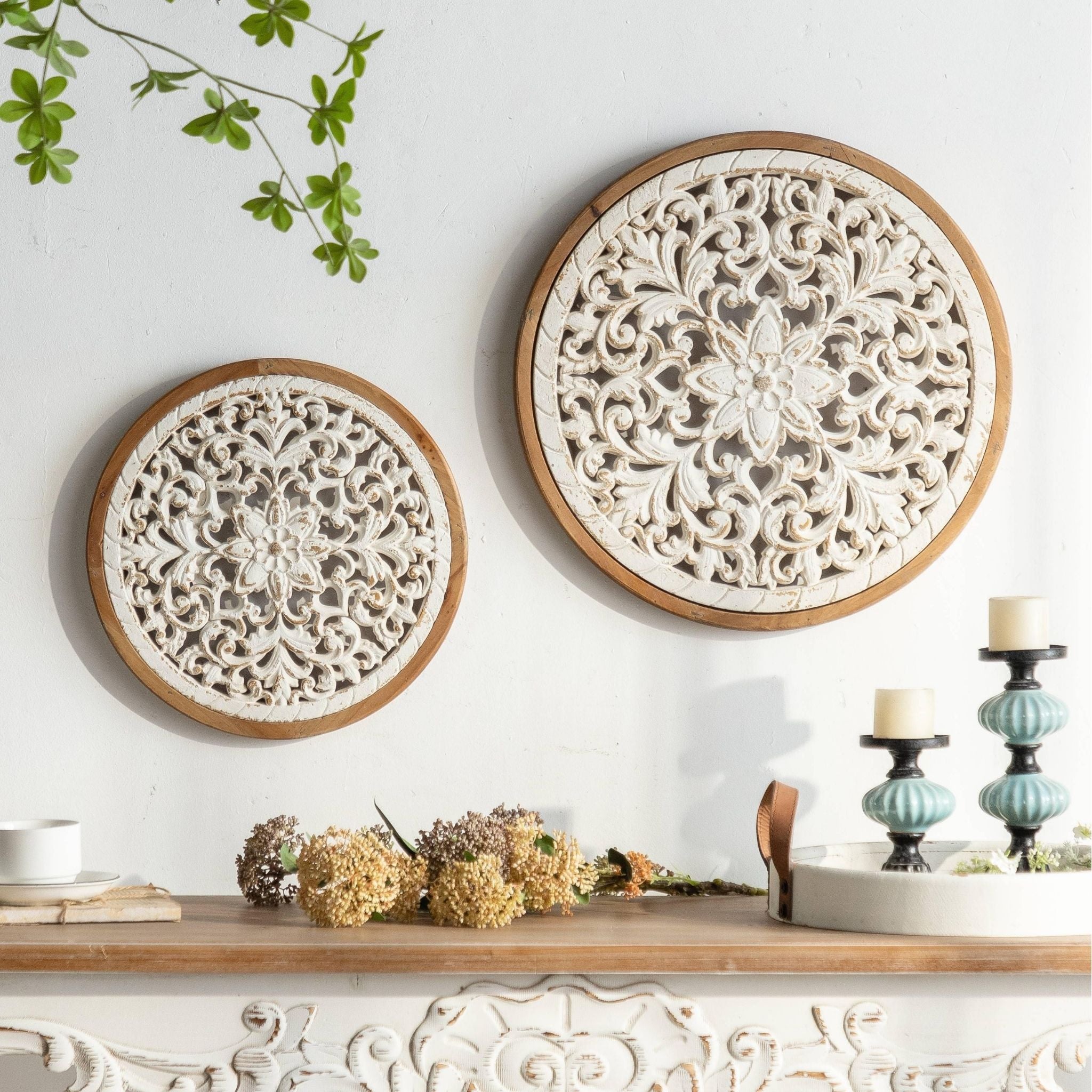 Vera round carved panel styled on a wall with her larger companion