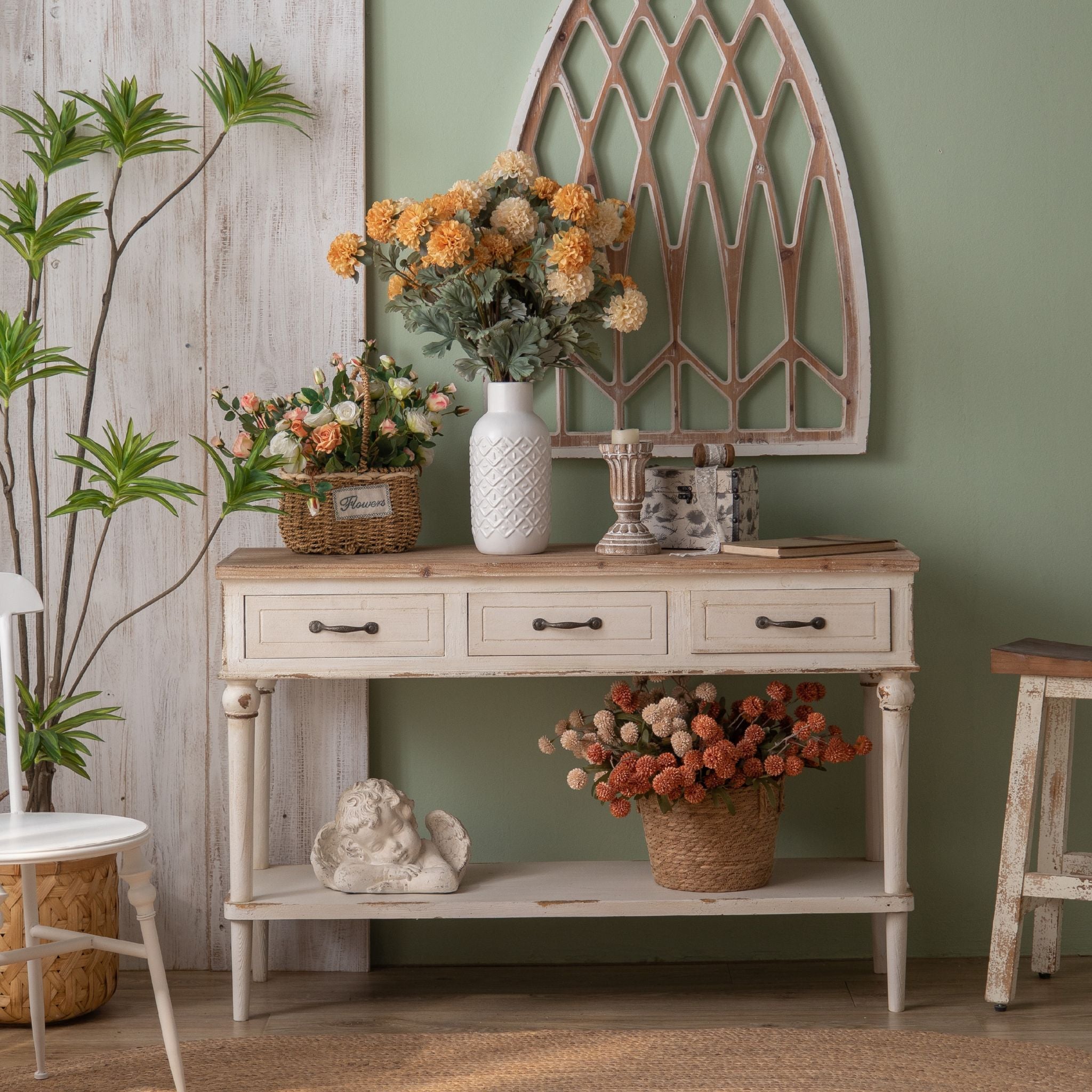 Seville console table in distressed white with natural fir top styled with flowers and baskets