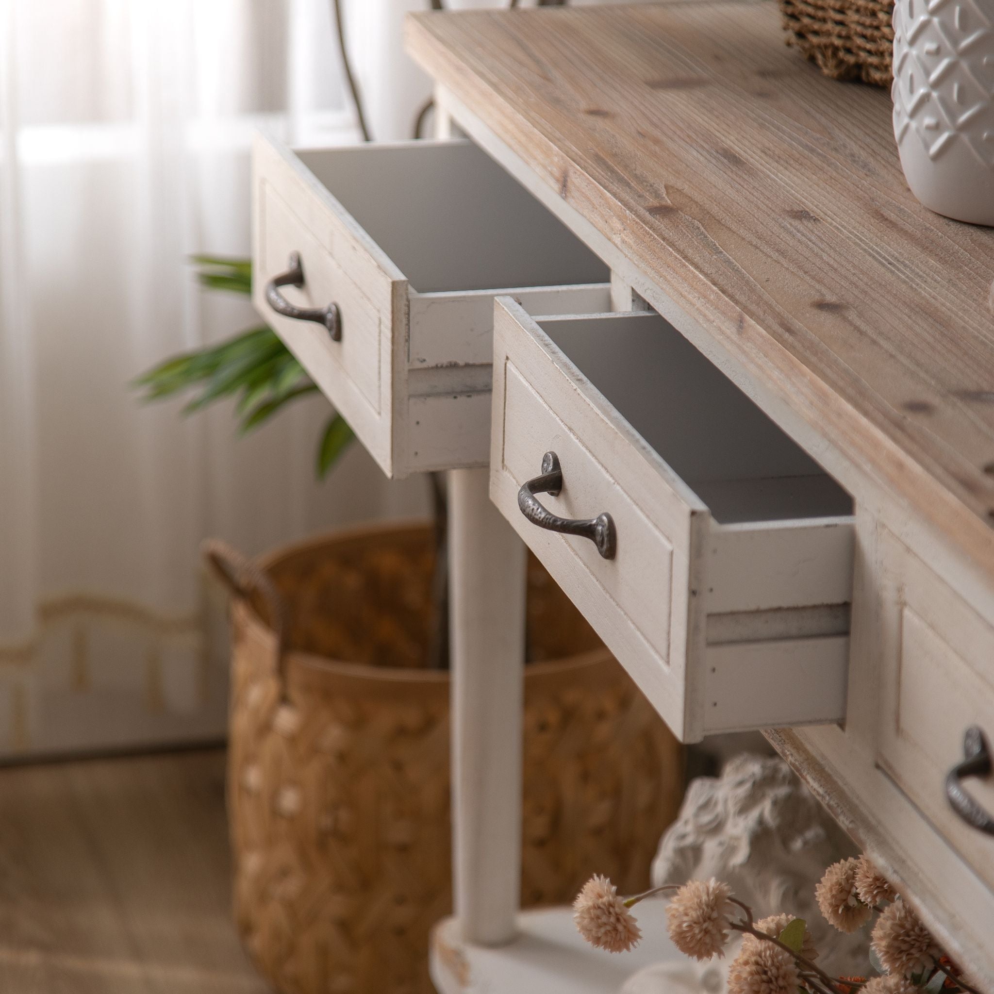 Close view of the natural fir grain and aged metal handles on the Seville console top
