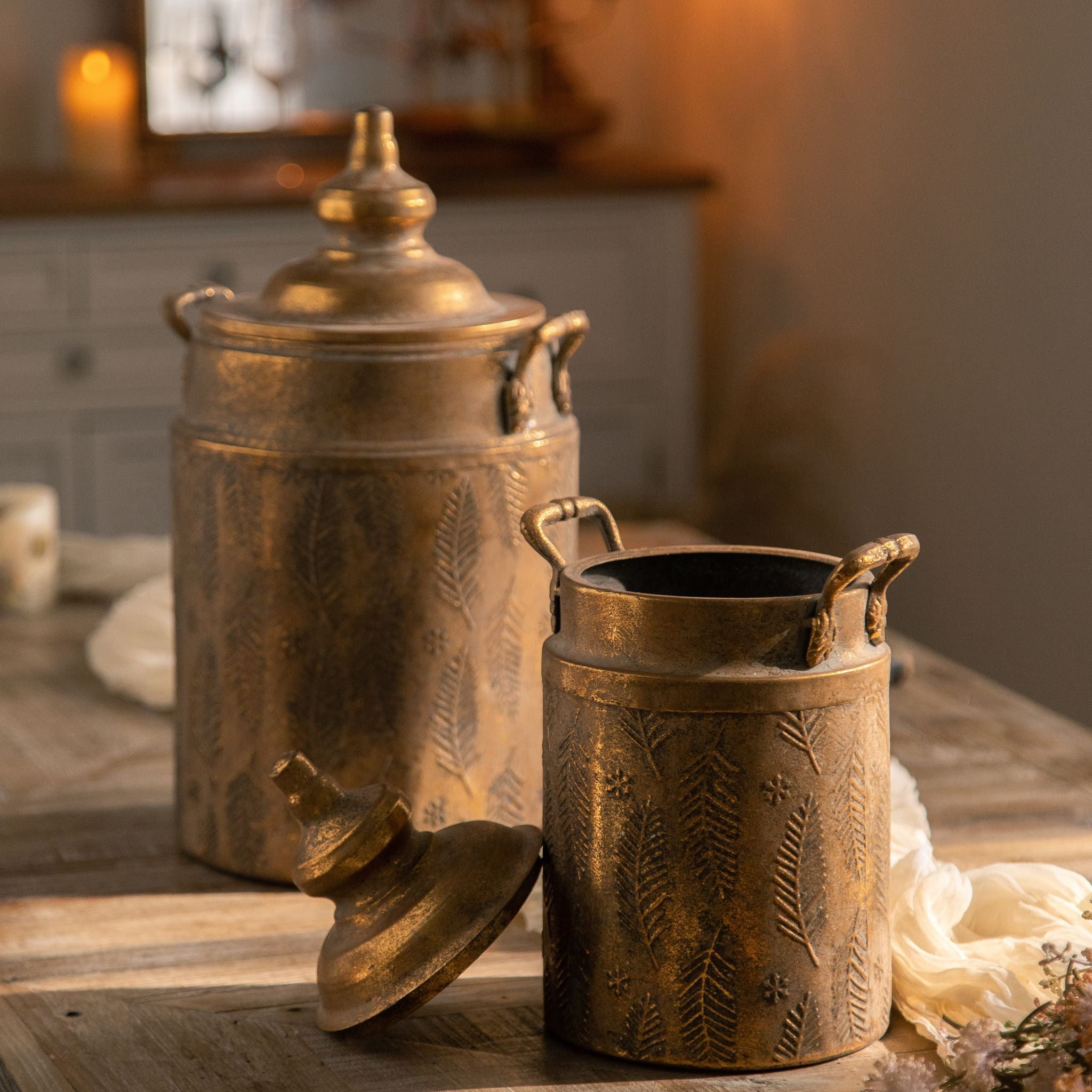 Rocco canister with lid set aside holding dried flowers on a timber table