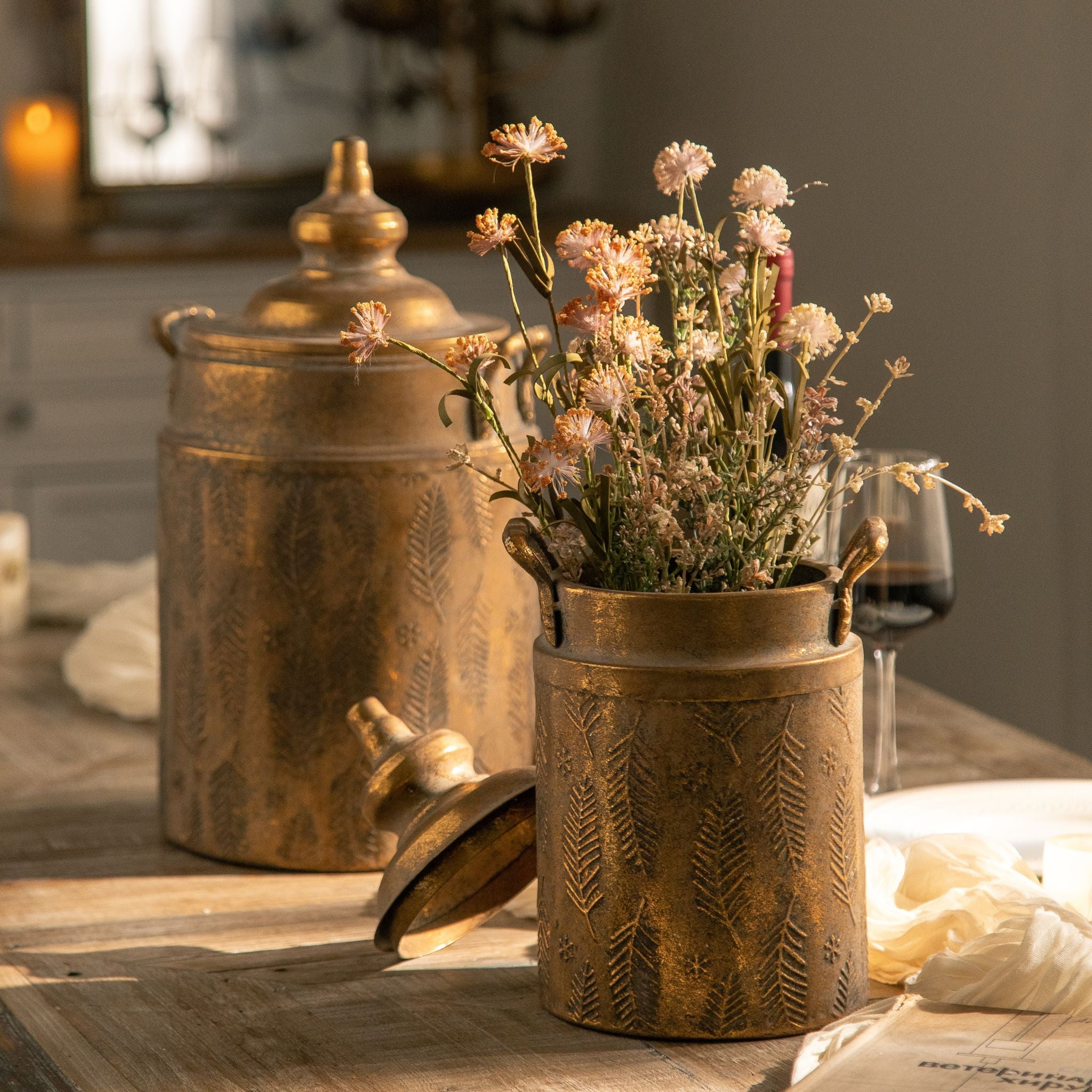 Close view of the embossed fern pattern and handles on the Rocco canister