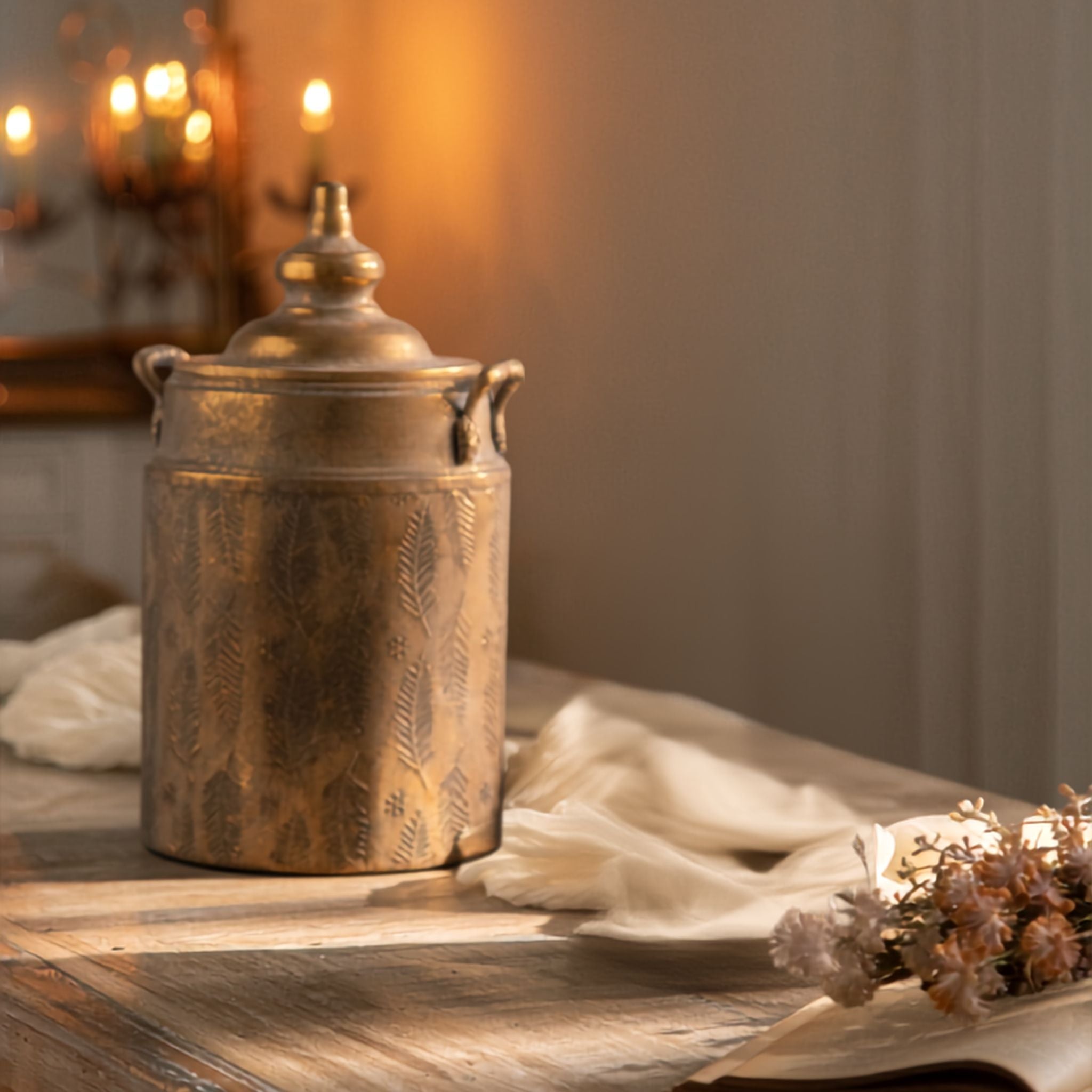 Rudi large lidded canister in antique gold with embossed fern pattern and side handles