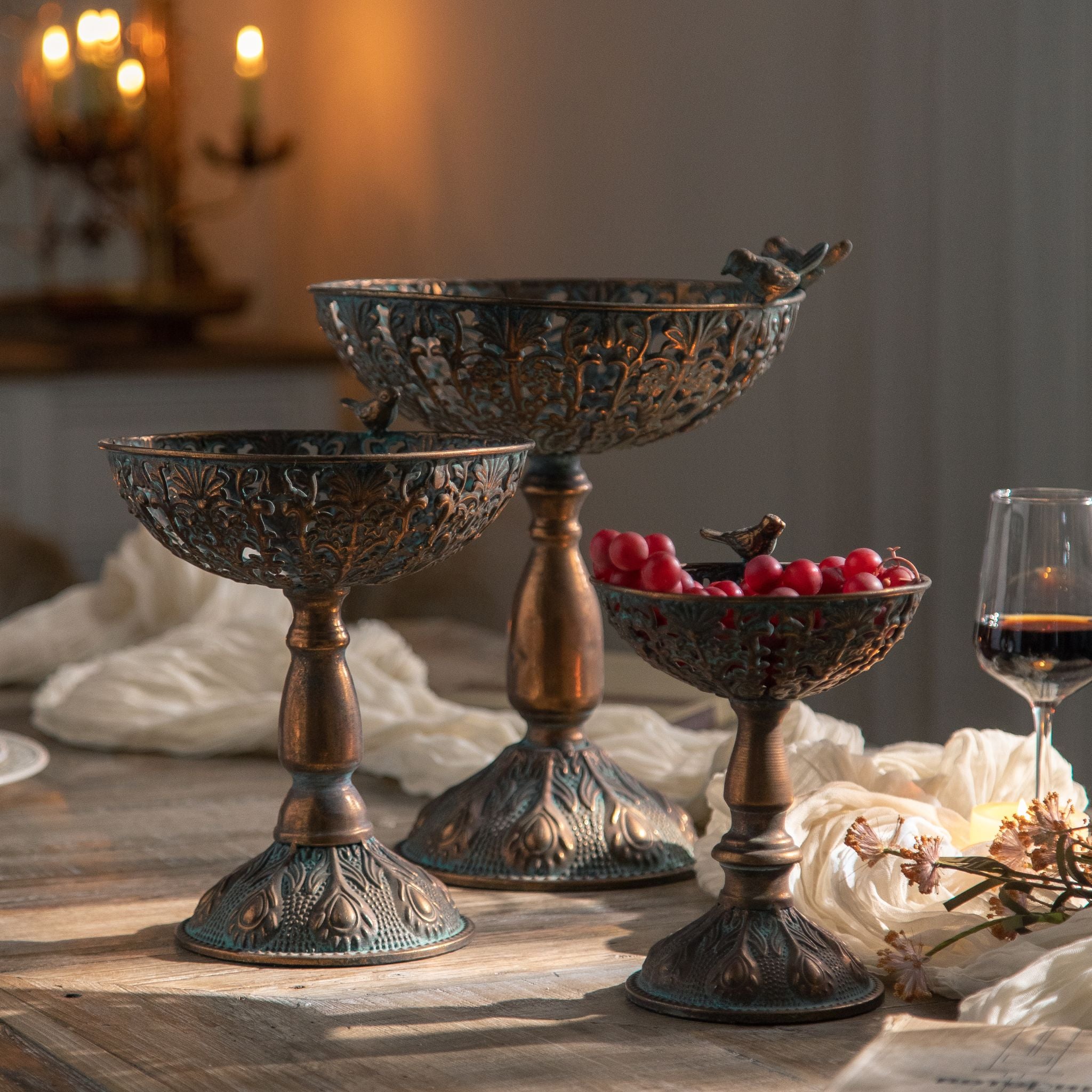 Sandro pedestal bowl styled on a timber table with candlelight behind
