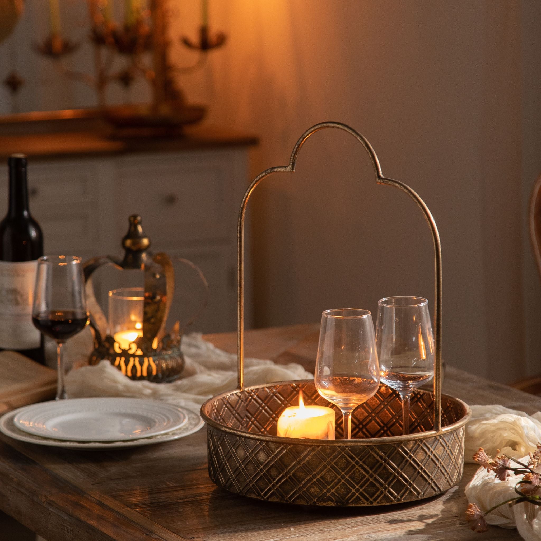 Remo handled tray styled on a dining table with wine glasses and candlelight