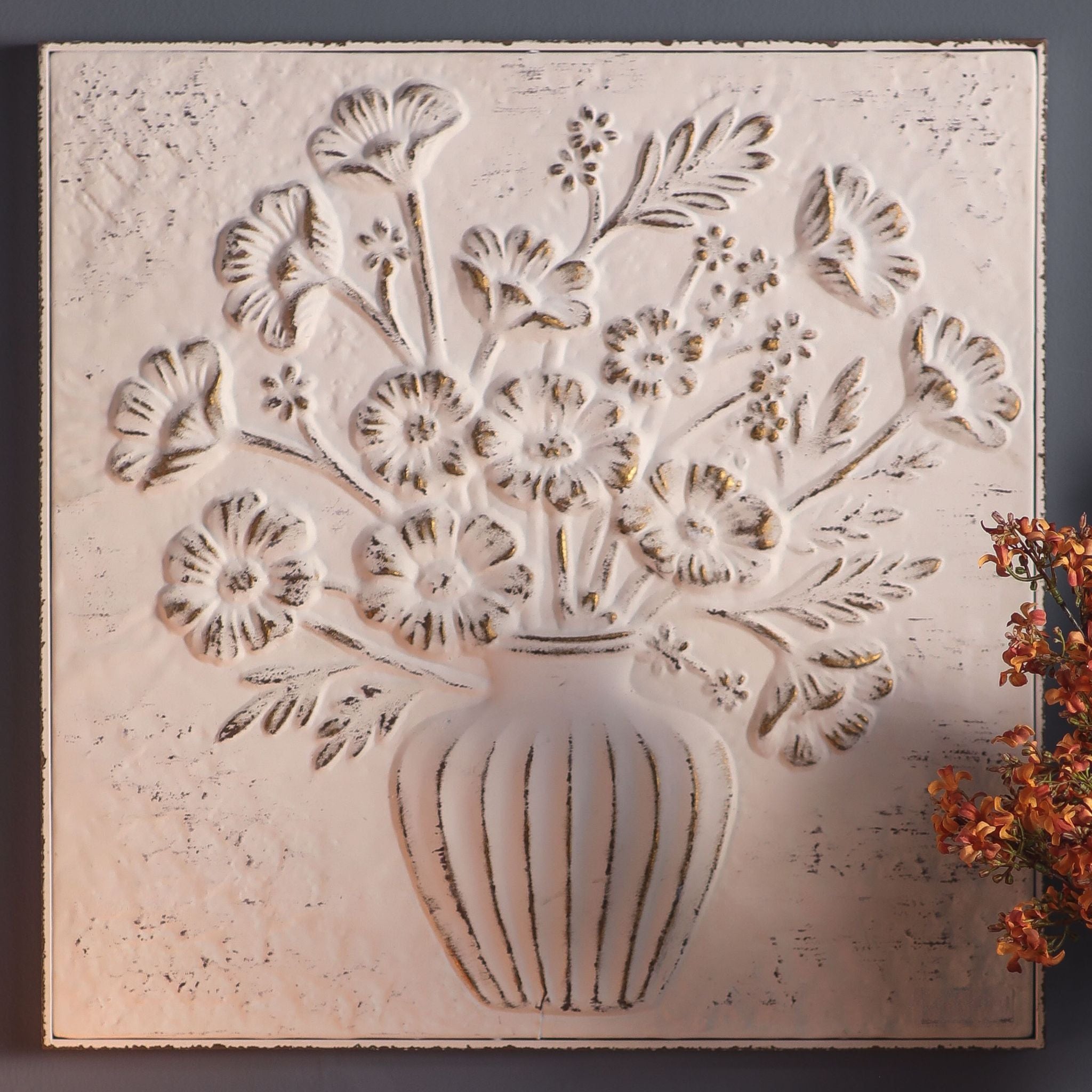 Close view of the embossed flowers and distressed edge on the Pia wall panel