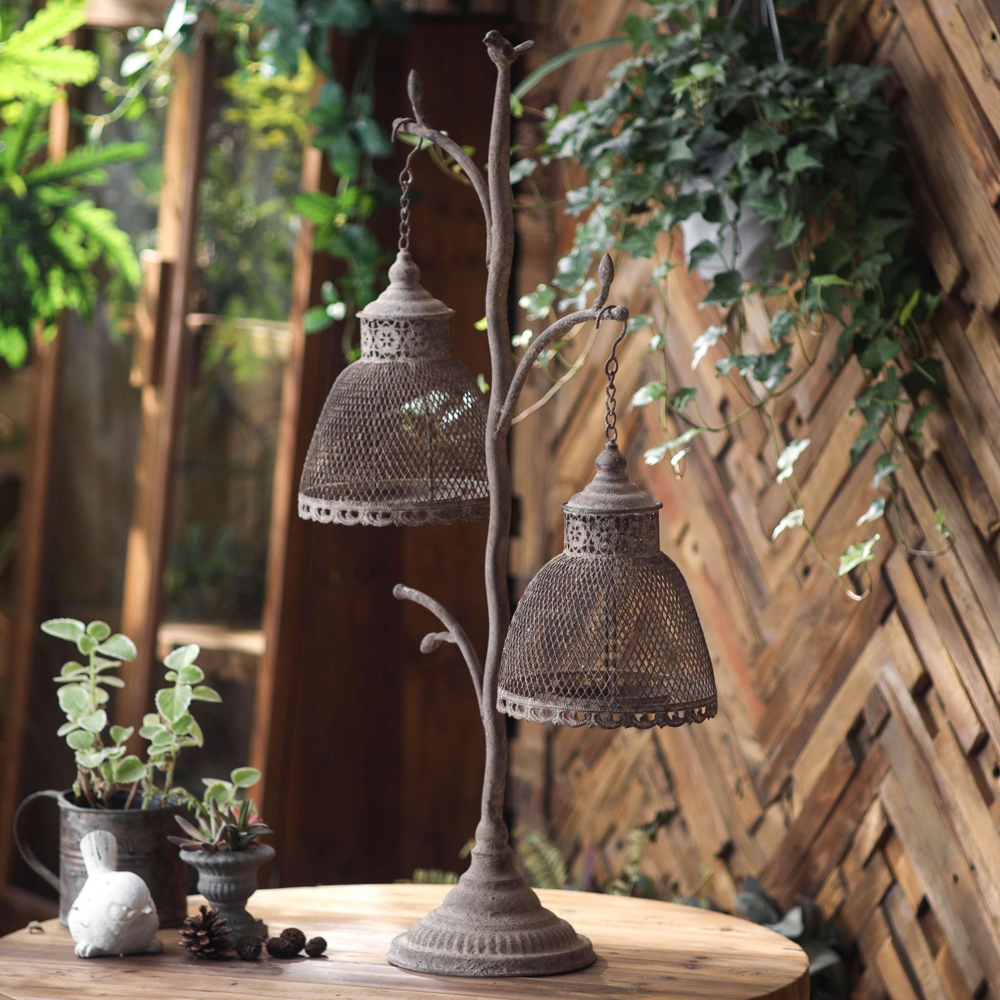 Detail of the fluted round base and weathered finish on the Giorgio lantern stand