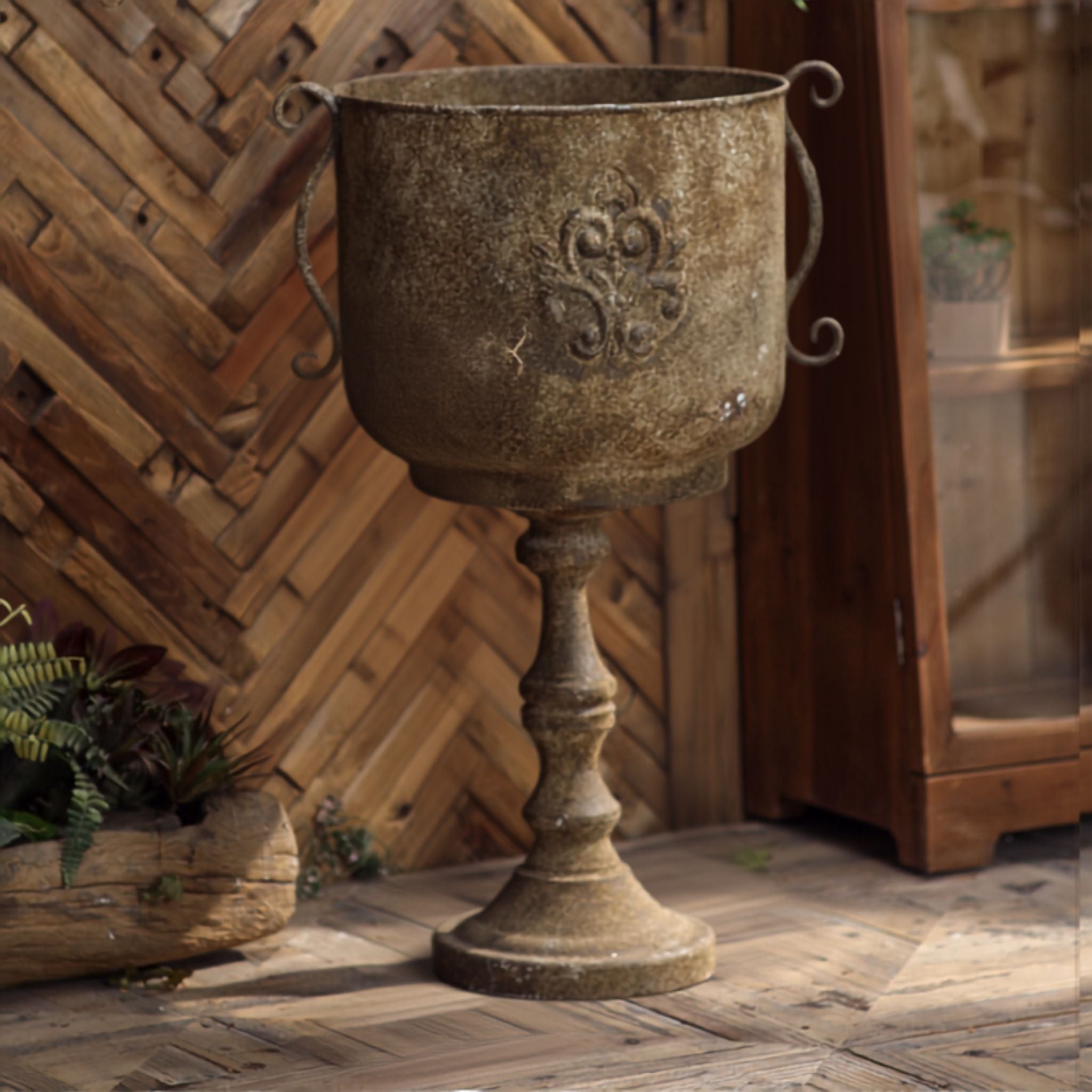 Gloria pedestal urn planter in aged iron with fleur de lis crest and scroll handles