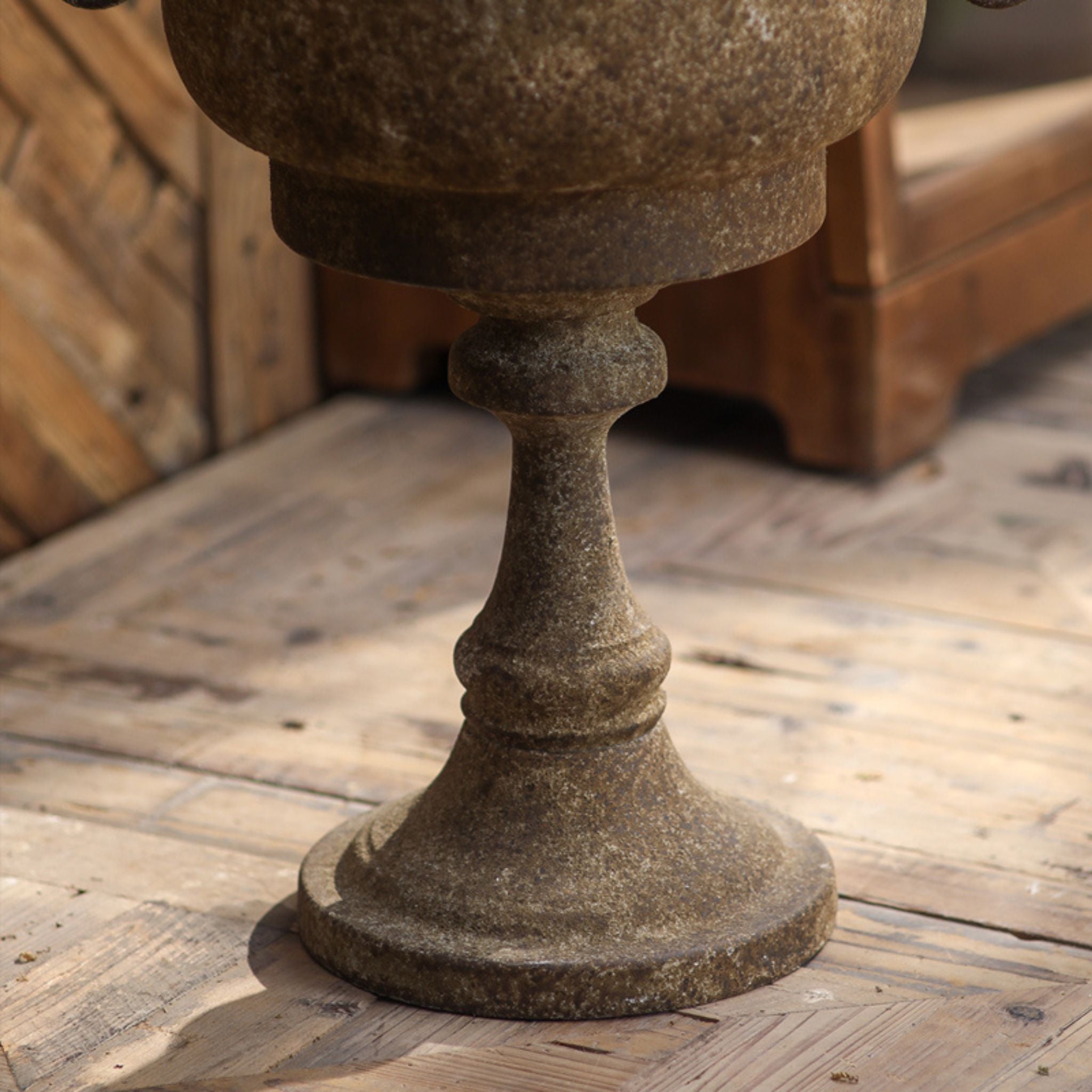 Detail of the turned baluster pedestal and round foot on the Gloria urn