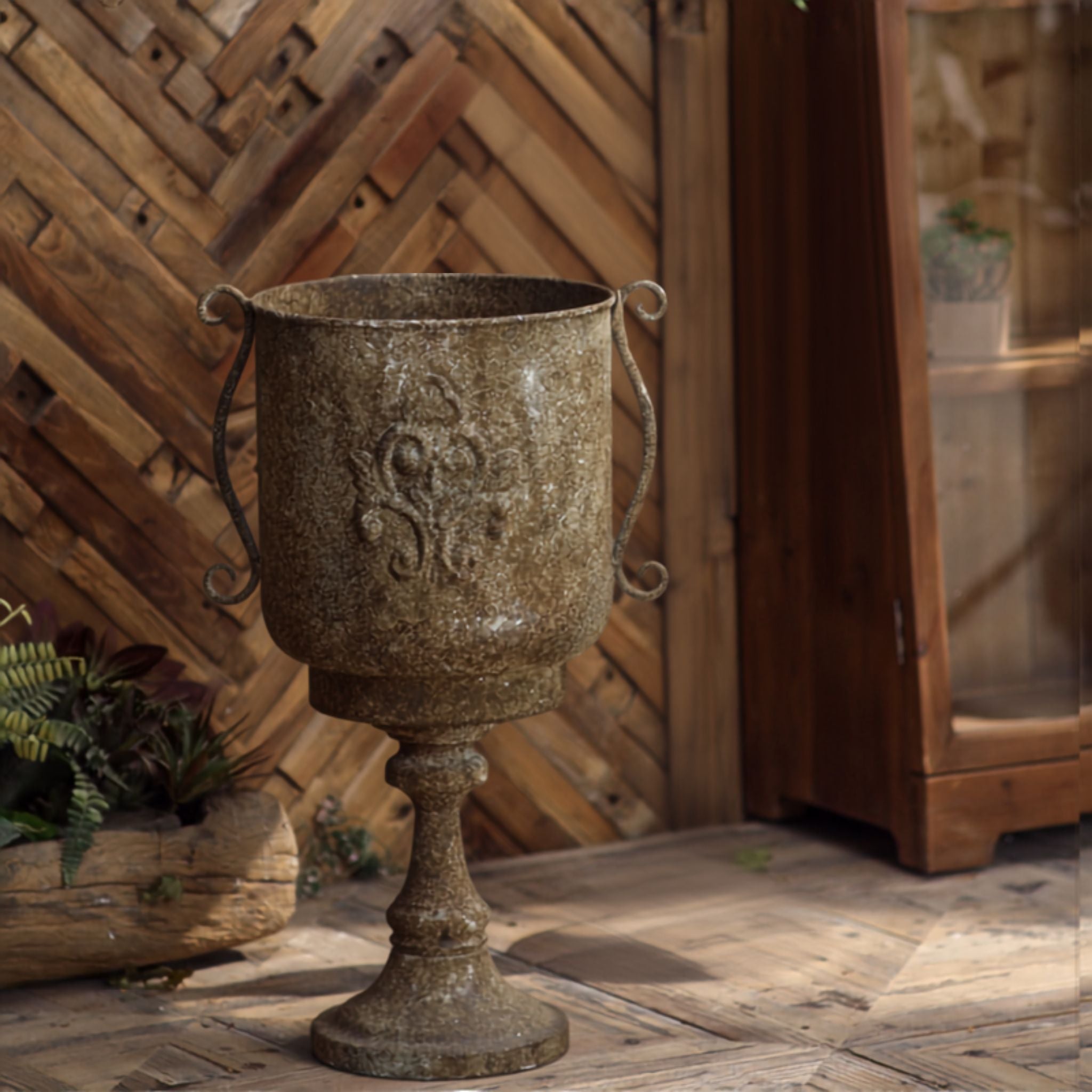 Ronda pedestal urn planter in aged iron with fleur de lis crest and scroll handles