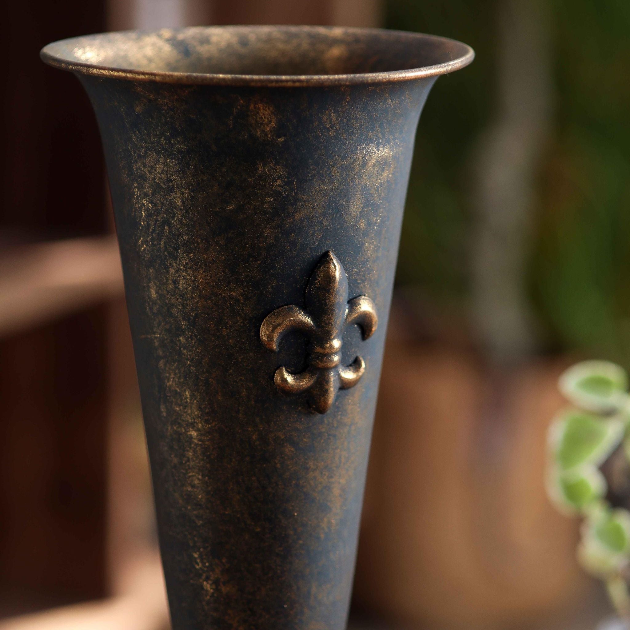 Looking into the flared trumpet rim of the Guido urn vase