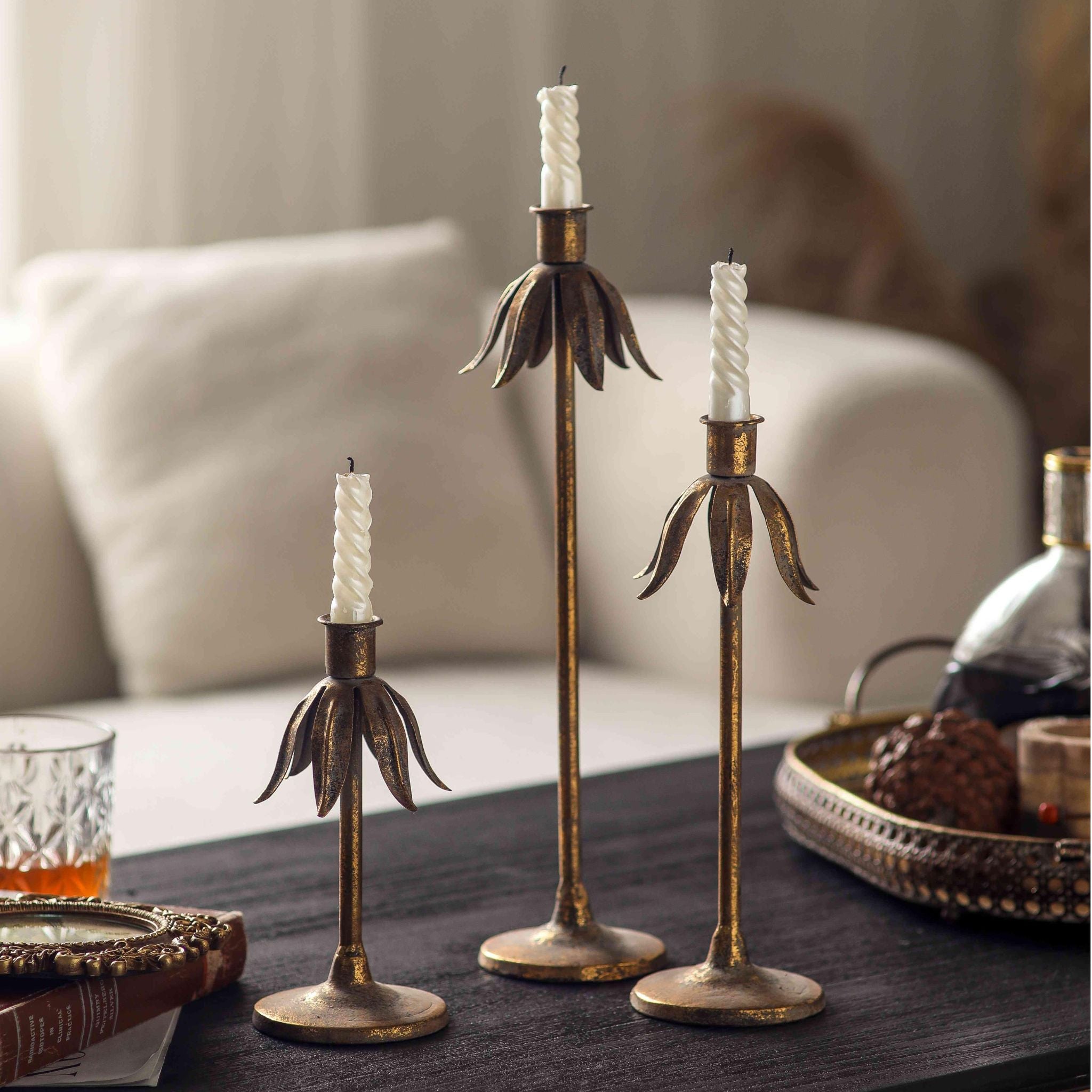 The three Ines candle holders styled with a mirrored tray and whisky glass