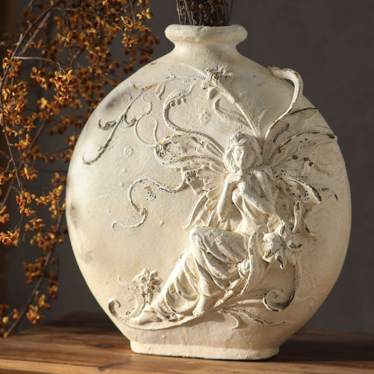 Close detail of the Mélusine vase showing the fairy, wings and flowering vine standing proud of the chalk white surface