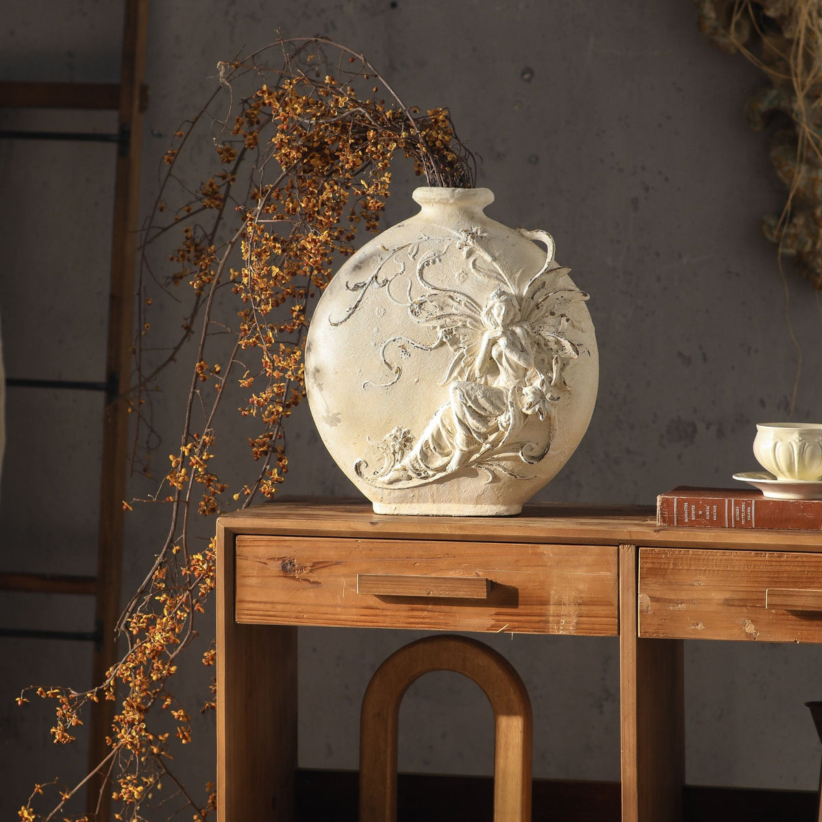 Mélusine vase styled in a French country room with dried branches, timber console and ladder