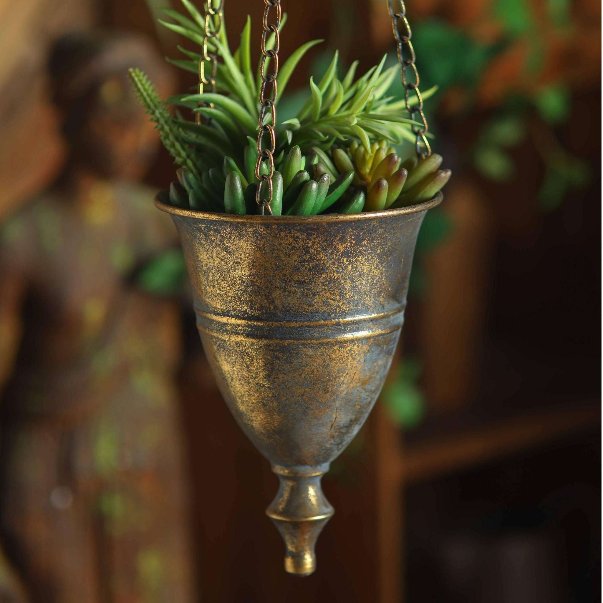 Close view of the bell cup, banding and drop finial on the Nino hanging planter