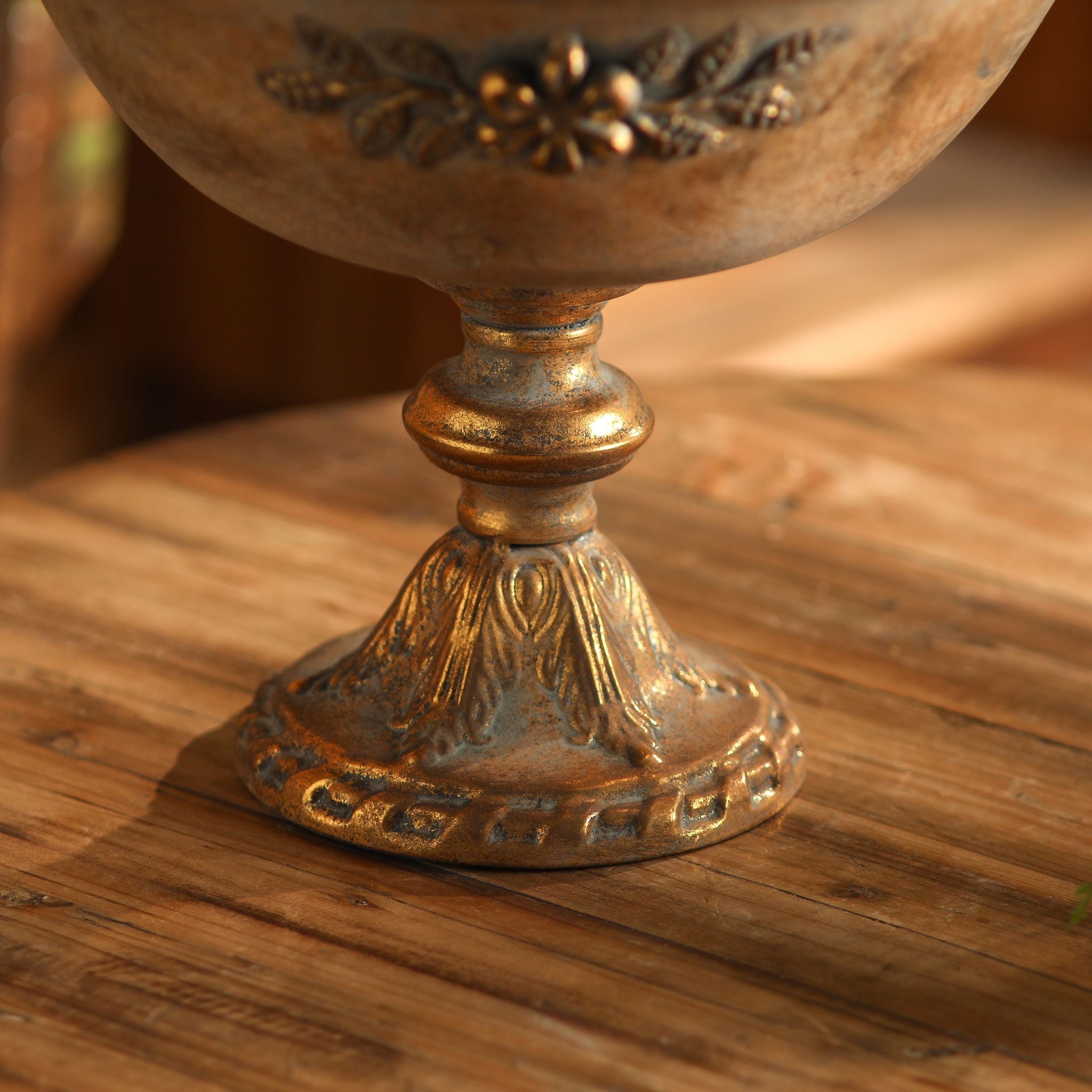 Looking into the wide gold bowl of the Orlando compote showing the mottled patina